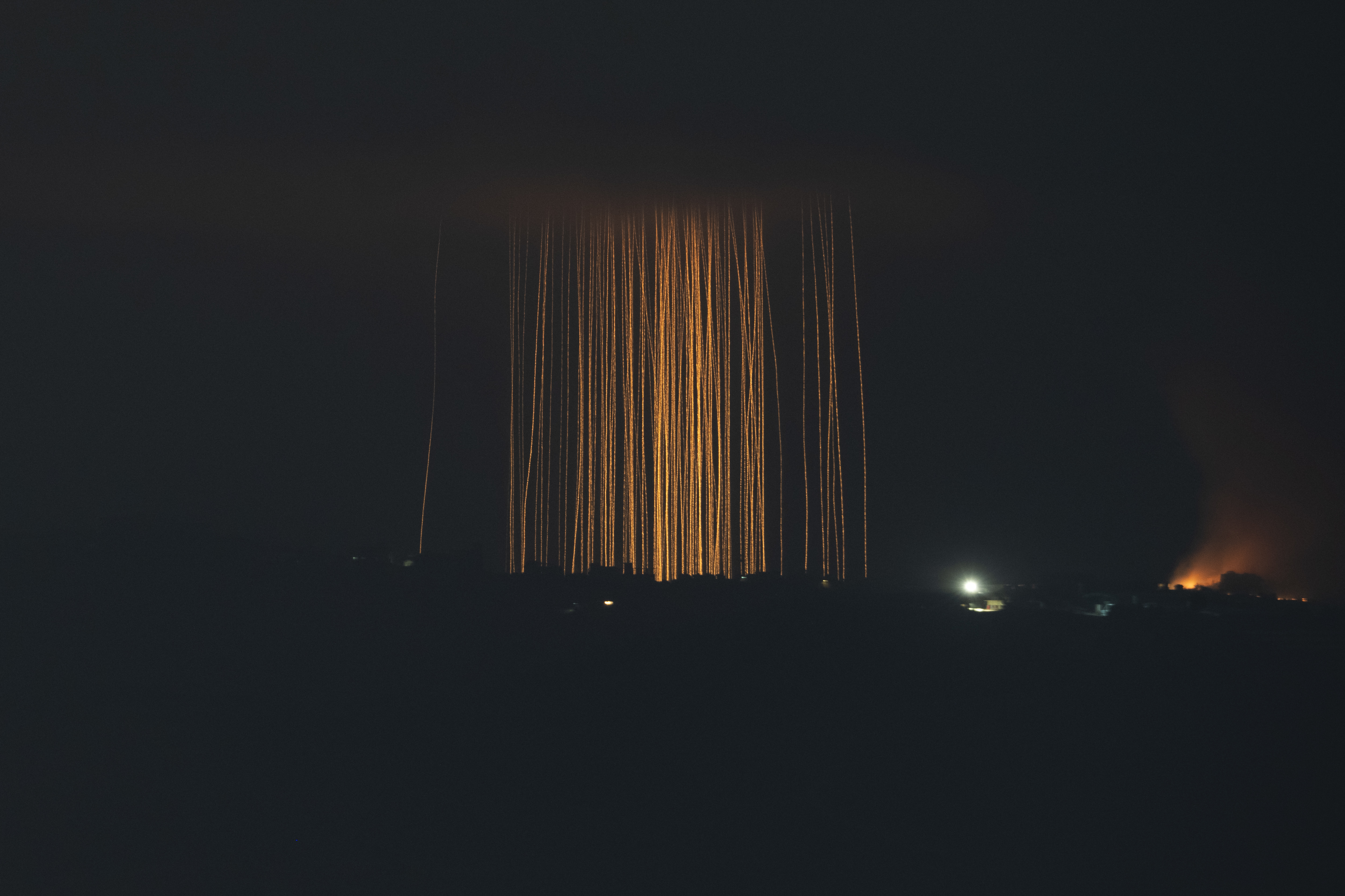 Israeli shelling hit an area in southern Lebanon as seen from northern Israel, Monday, Sept. 30, 2024. (AP Photo/Leo Correa)