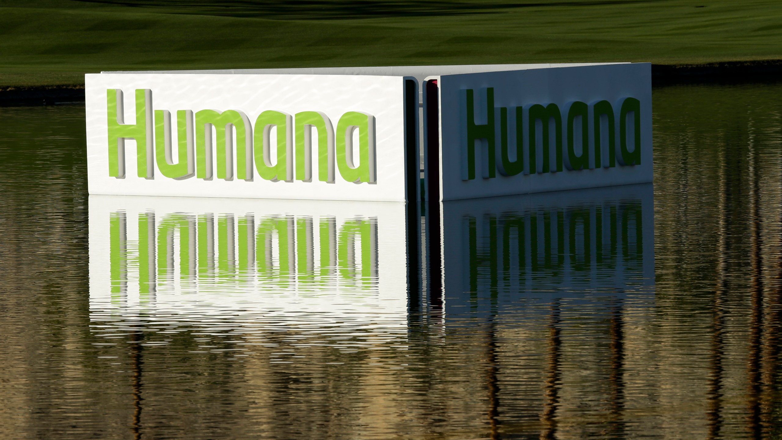 FILE - A Humana logo is seen in a lake on the Palmer Private Course at PGA West during the first round of the Humana Challenge PGA golf tournament in La Quinta, Calif., Jan. 17, 2013. (AP Photo/Ben Margot, File)