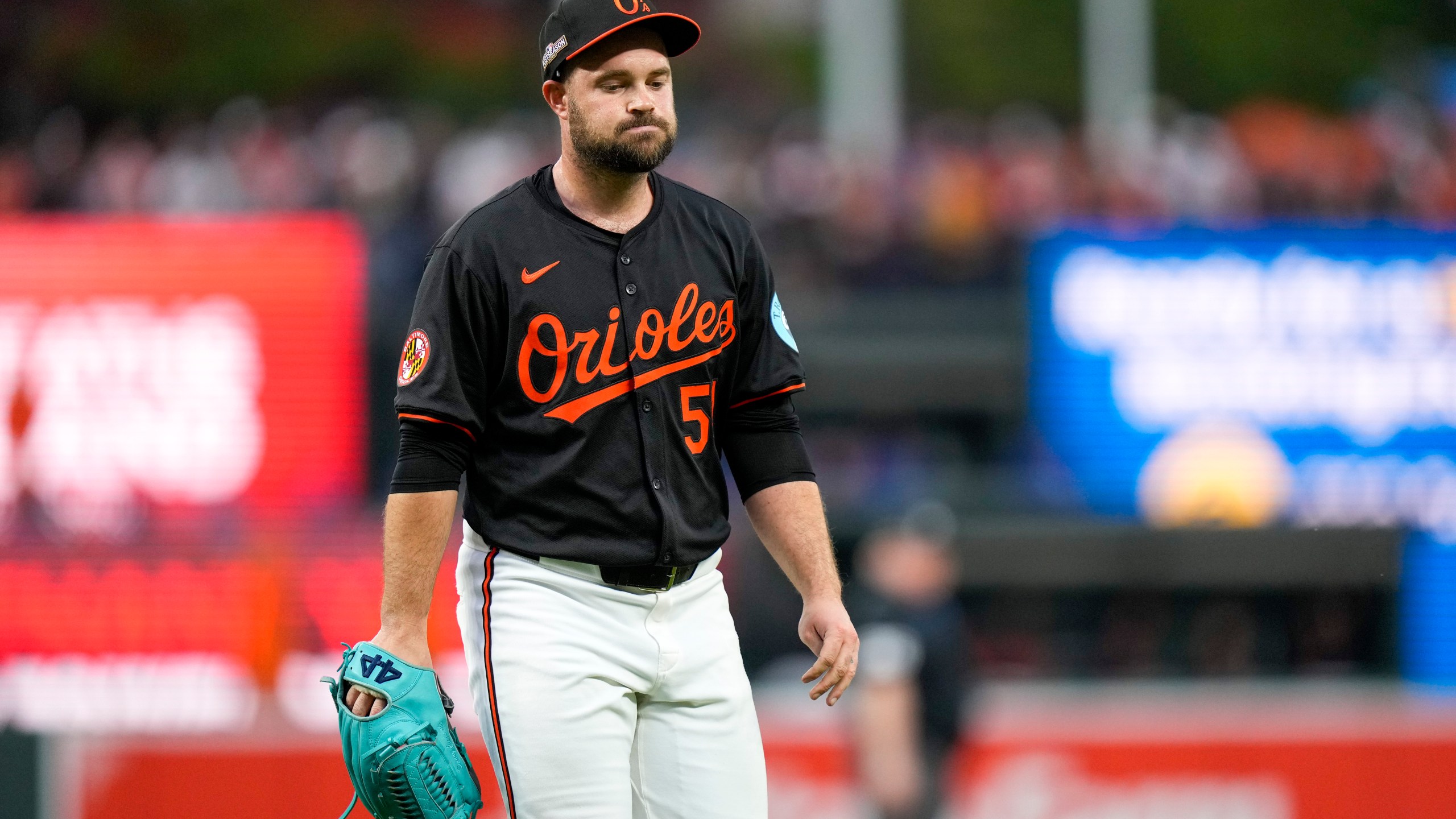 Baltimore Orioles pitcher Danny Coulombe heads to the dugout after being relieved during the fifth inning in Game 2 of an AL Wild Card Series baseball game against the Kansas City Royals, Wednesday, Oct. 2, 2024 in Baltimore. (AP Photo/Stephanie Scarbrough)