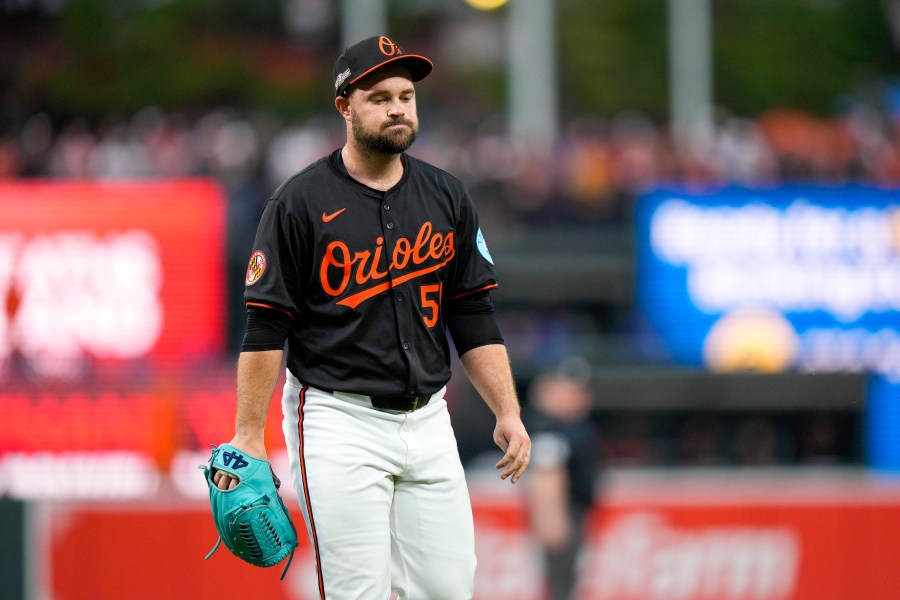 Baltimore Orioles pitcher Danny Coulombe heads to the dugout after being relieved during the fifth inning in Game 2 of an AL Wild Card Series baseball game against the Kansas City Royals, Wednesday, Oct. 2, 2024 in Baltimore. (AP Photo/Stephanie Scarbrough)