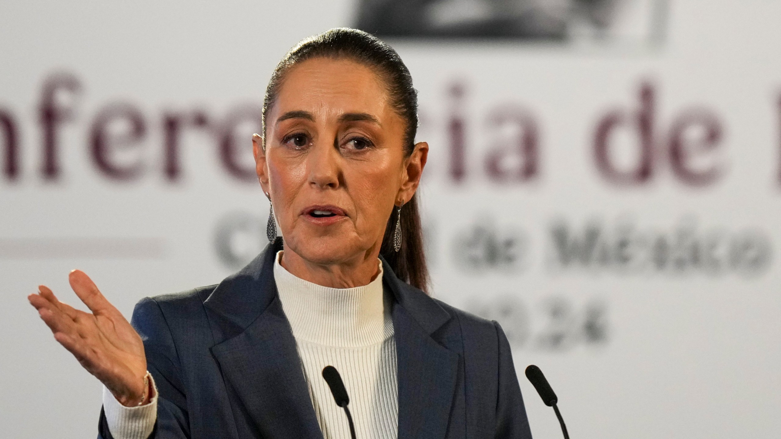 Mexican President Claudia Sheinbaum gives a media briefing from the National Palace in Mexico City, Wednesday, Oct. 2, 2024, the morning after her inauguration. (AP Photo/Fernando Llano)