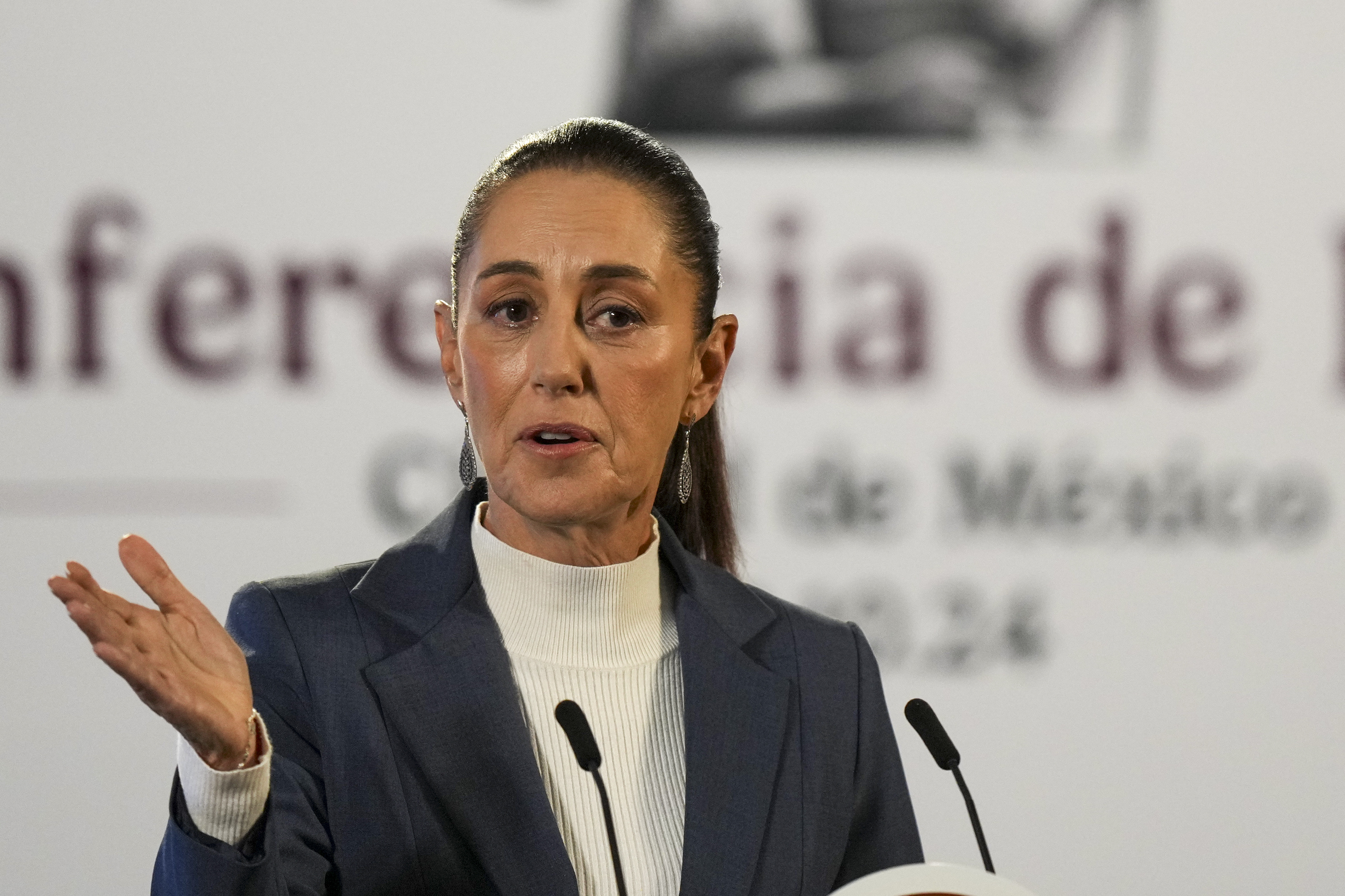 Mexican President Claudia Sheinbaum gives a media briefing from the National Palace in Mexico City, Wednesday, Oct. 2, 2024, the morning after her inauguration. (AP Photo/Fernando Llano)