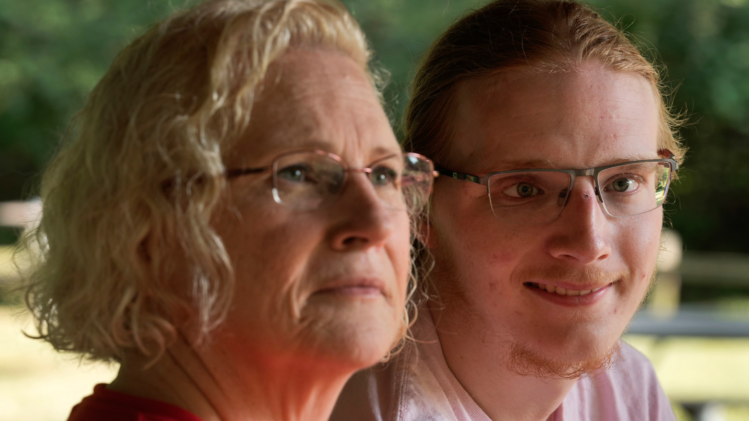 Denise Wieck and her son Guy Boyd, who was shot in the eye with a ghost gun, pose in Ypsilanti, Mich., Saturday, Sept. 14, 2024. (AP Photo/Paul Sancya)