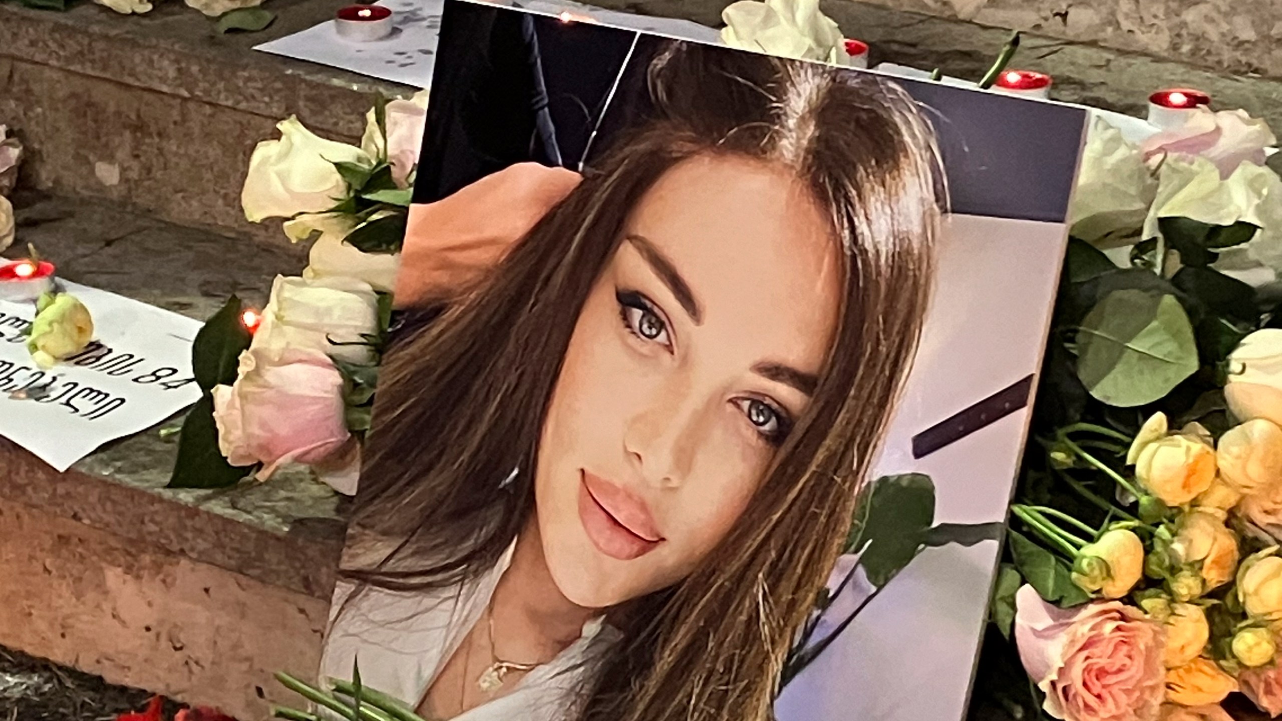 A portrait of Kesaria Abramidze, a transgender actor and model who was stabbed to death, is displayed at a vigil near parliament in Tbilisi, Georgia, Thursday, Sept. 19, 2024. (AP Photo/Sophiko Megrelidze)