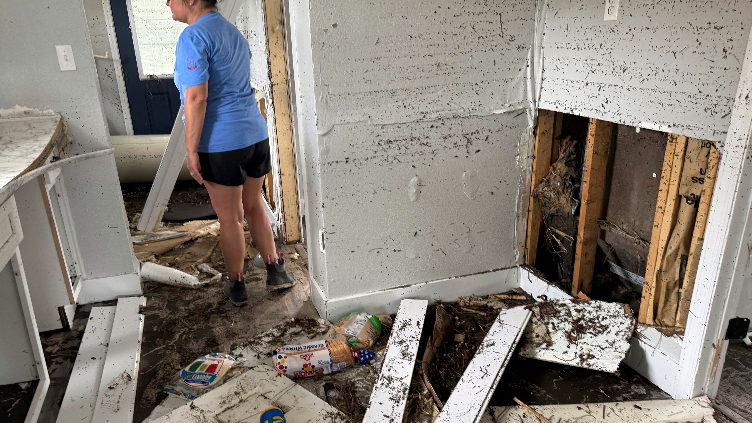 Brooke Hiers surveys the damage done to her home, Monday, Sept. 30, 2024, in Horseshoe Beach, Fla., in the aftermath of Hurricane Helene. Hiers and her husband rebuilt the home in the wake of Hurricane Idalia, which washed ashore in August, 2023, only to see it destroyed by another storm 13 months later. (AP Photo/Kate Payne)