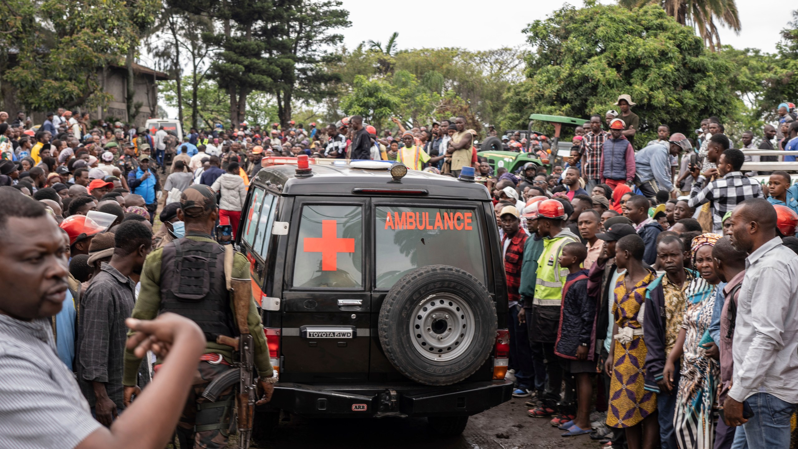 An ambulance carries victims away from the port of Goma, Democratic Republic of Congo, after a ferry carrying hundreds capsized on arrival Thursday, Oct. 3, 2024. (AP Photo/Moses Sawasawa)