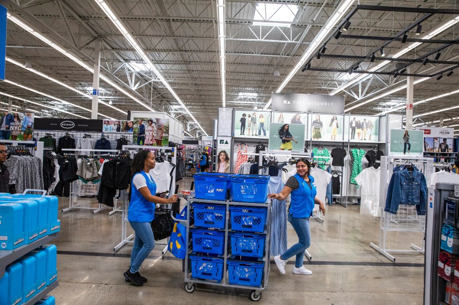 FILE - Walmart workers organize merchandise at a Superstore in Secaucus, New Jersey, July 11, 2024. (AP Photo/Eduardo Munoz Alvarez, File)