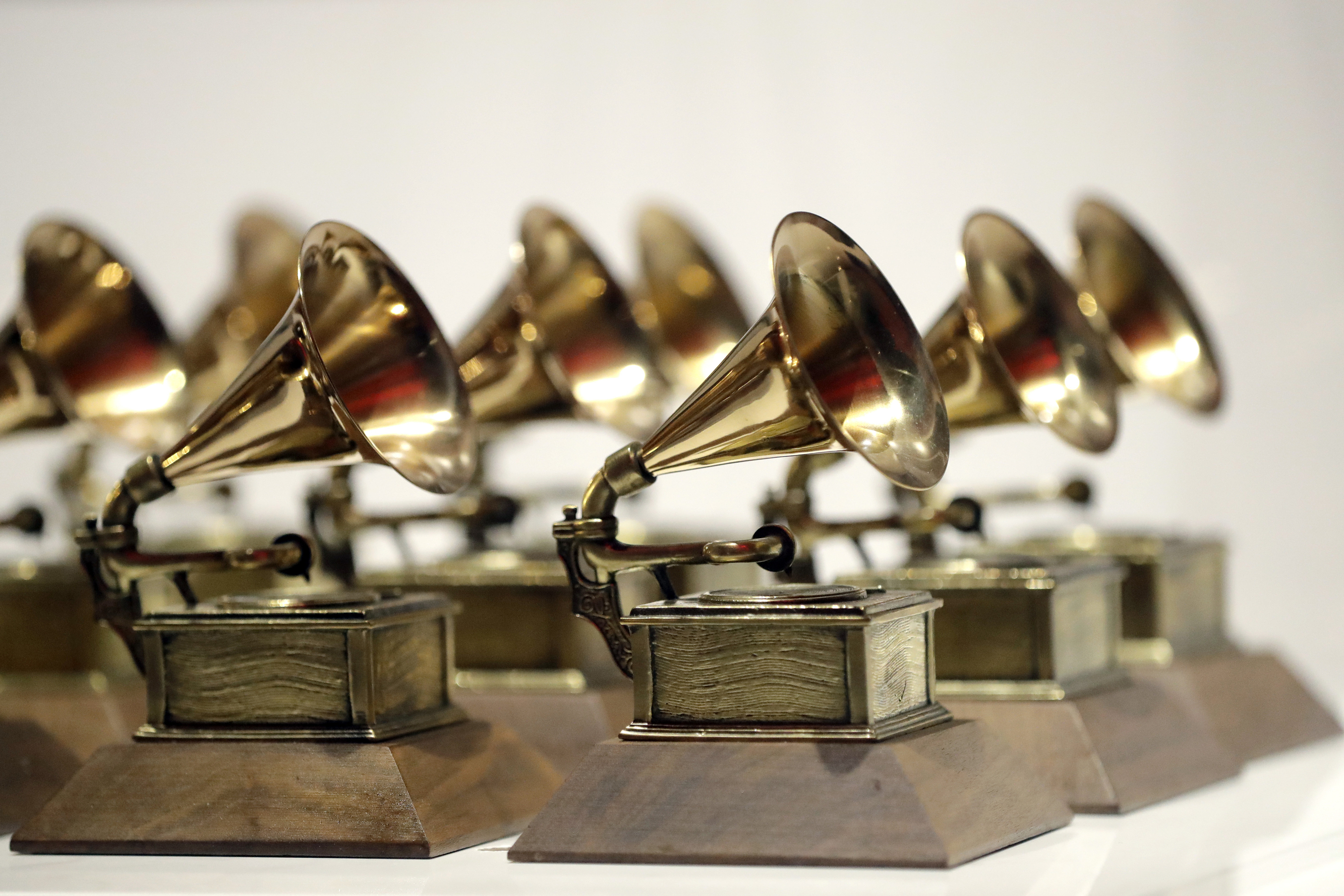 FILE - Grammy Awards are displayed at the Grammy Museum Experience at Prudential Center in Newark, N.J. on Oct. 10, 2017. (AP Photo/Julio Cortez, File)