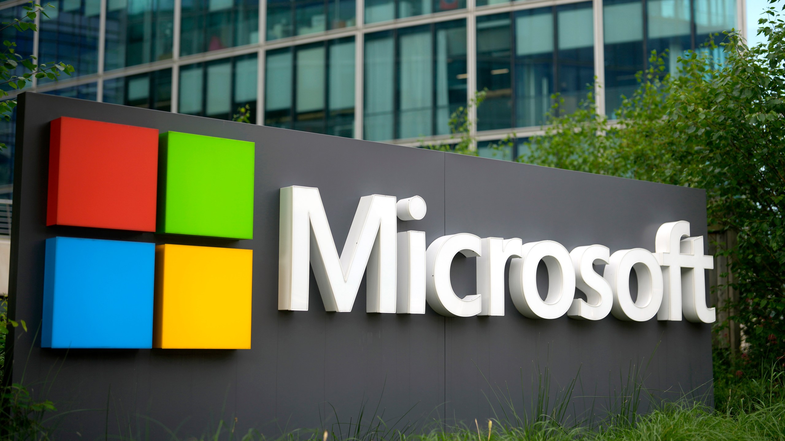 FILE - The Microsoft logo is displayed outside its French headquarters in Issy-les-Moulineaux, outside Paris, May 13, 2024. (AP Photo/Thibault Camus, File)