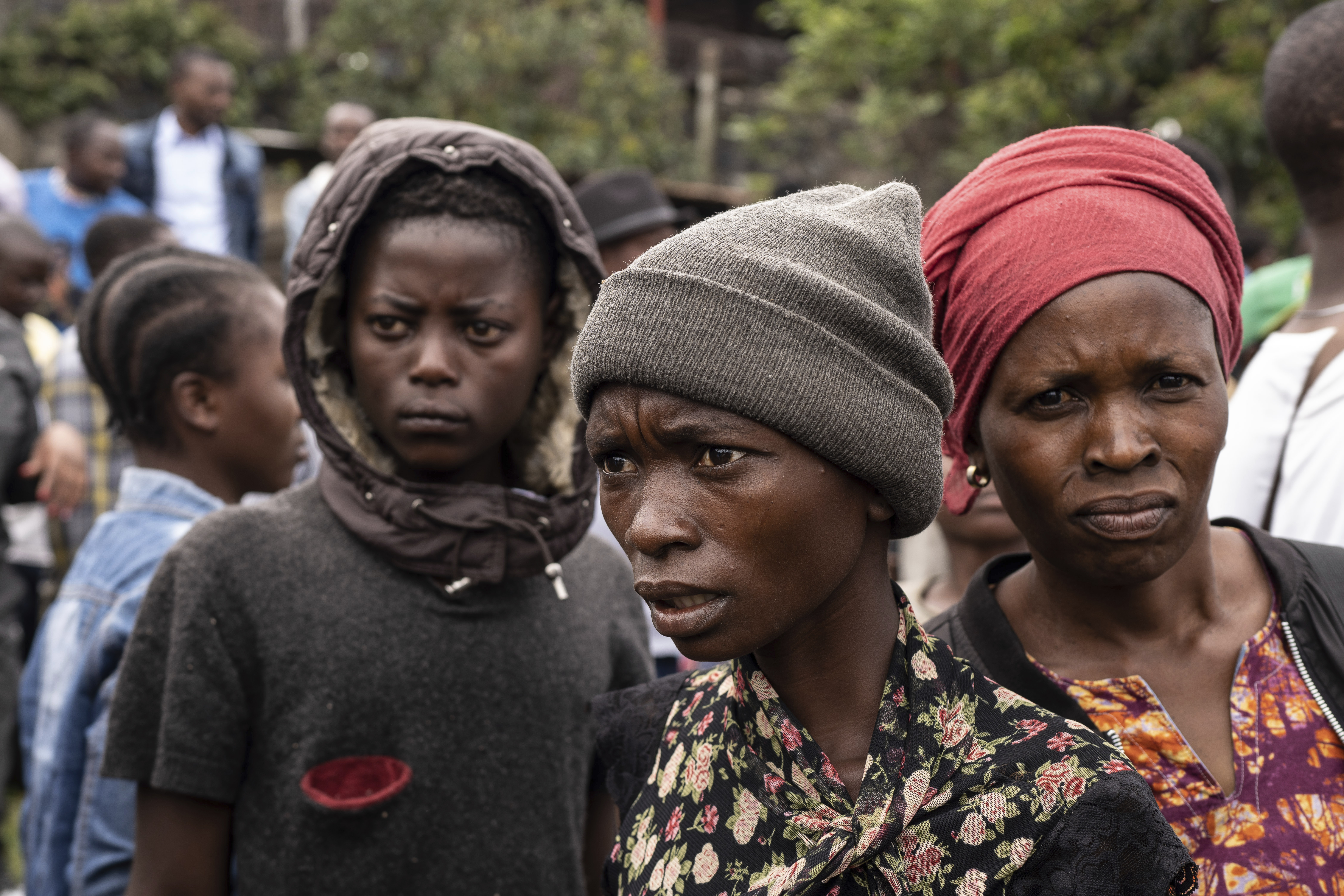 Onlookers gather at the port of Goma, Democratic Republic of Congo, after a ferry carrying hundreds capsized on arrival Thursday, Oct. 3, 2024. (AP Photo/Moses Sawasawa)