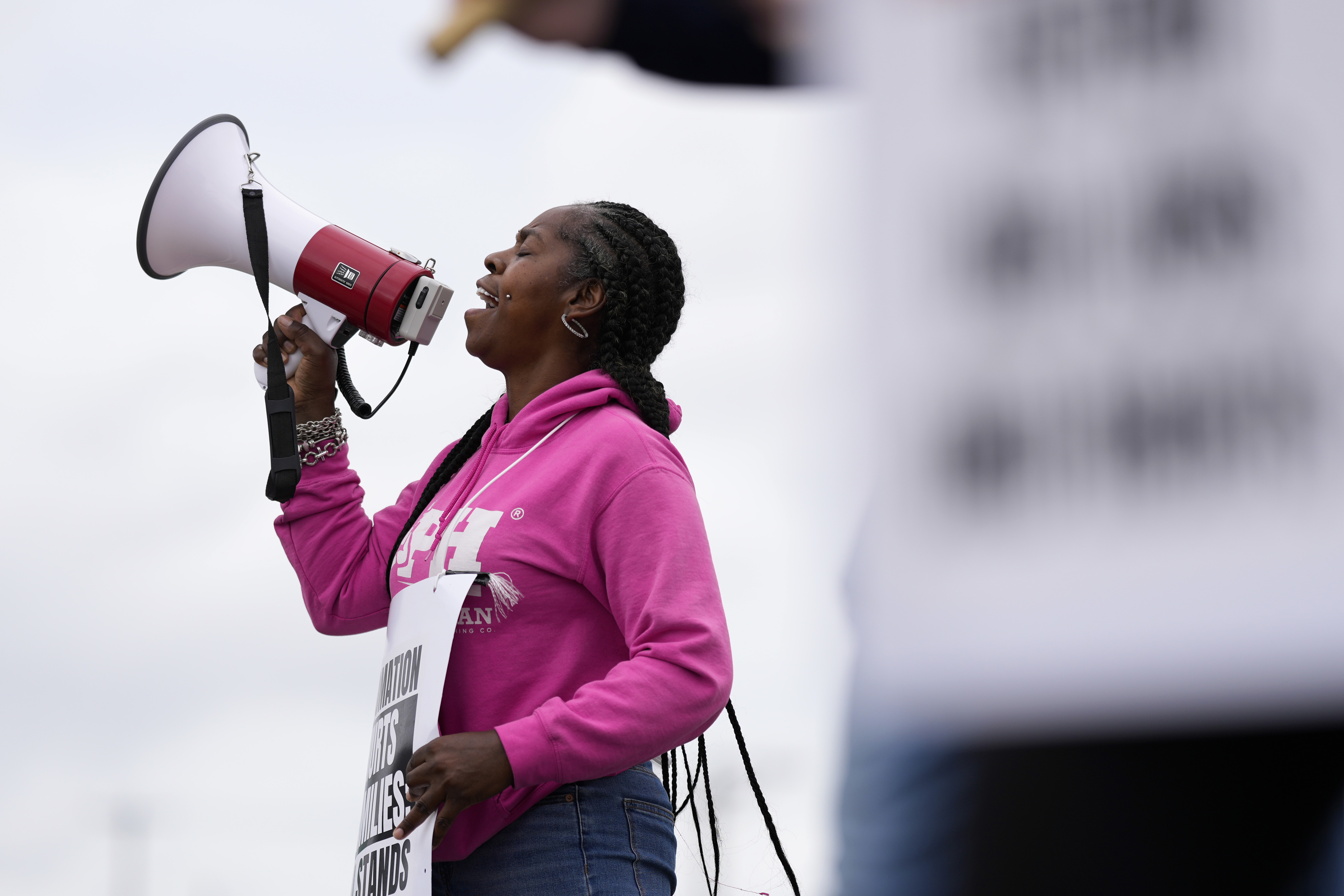 Striking longshoreman Teresa Whitte, of New York, pickets outside the Packer Avenue Marine Terminal Port, Tuesday, Oct. 1, 2024, in Philadelphia. (AP Photo/Matt Slocum)