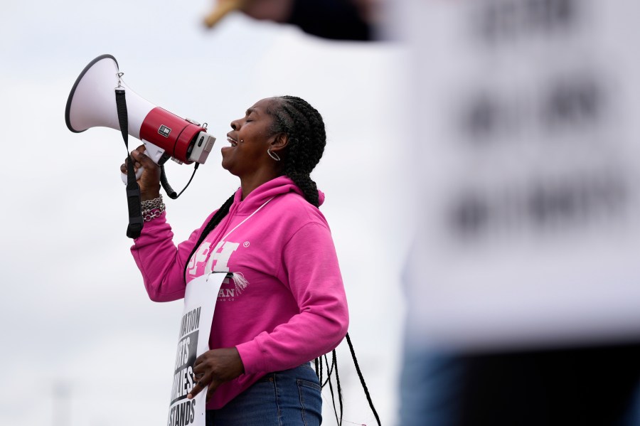 Striking longshoreman Teresa Whitte, of New York, pickets outside the Packer Avenue Marine Terminal Port, Tuesday, Oct. 1, 2024, in Philadelphia. (AP Photo/Matt Slocum)