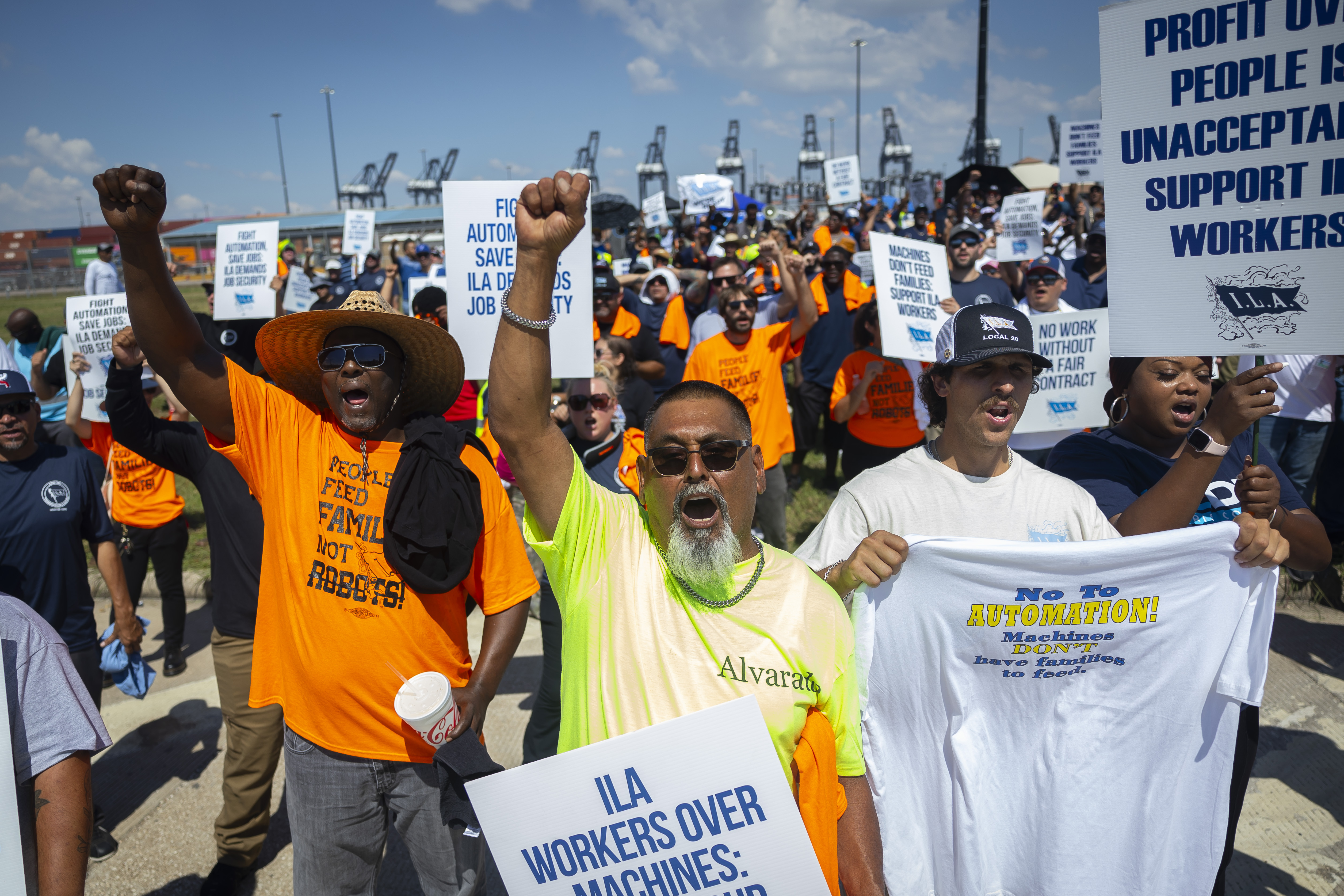 Francisco Alvarado, center, joins other ILA members during a strike at the Bayport Container Terminal on Tuesday, Oct. 1, 2024, in Houston. (AP Photo/Annie Mulligan)