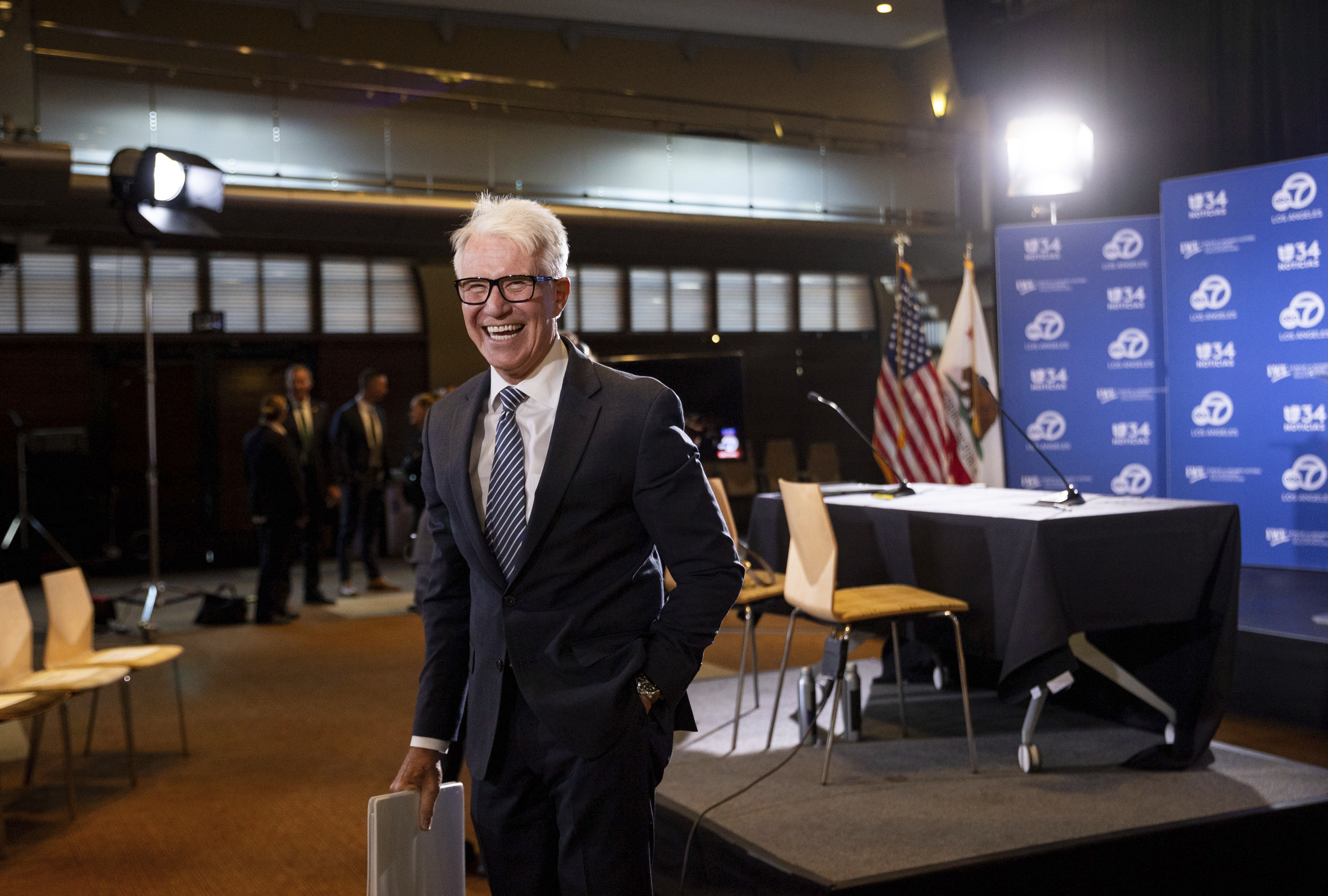 Los Angeles County District Attorney George Gascón greats audience members before the 2024 Los Angeles County district attorney candidate forum with former federal prosecutor Nathan Hochman in Los Angeles, Calif., Sunday, Sept. 29, 2024. (AP Photo/Ethan Swope)