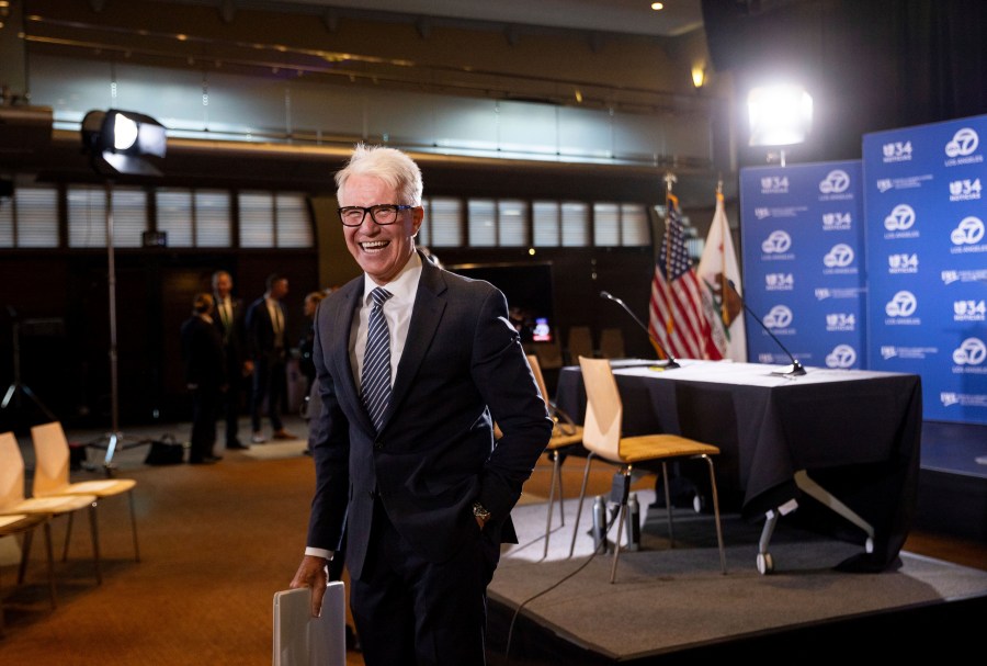 Los Angeles County District Attorney George Gascón greats audience members before the 2024 Los Angeles County district attorney candidate forum with former federal prosecutor Nathan Hochman in Los Angeles, Calif., Sunday, Sept. 29, 2024. (AP Photo/Ethan Swope)