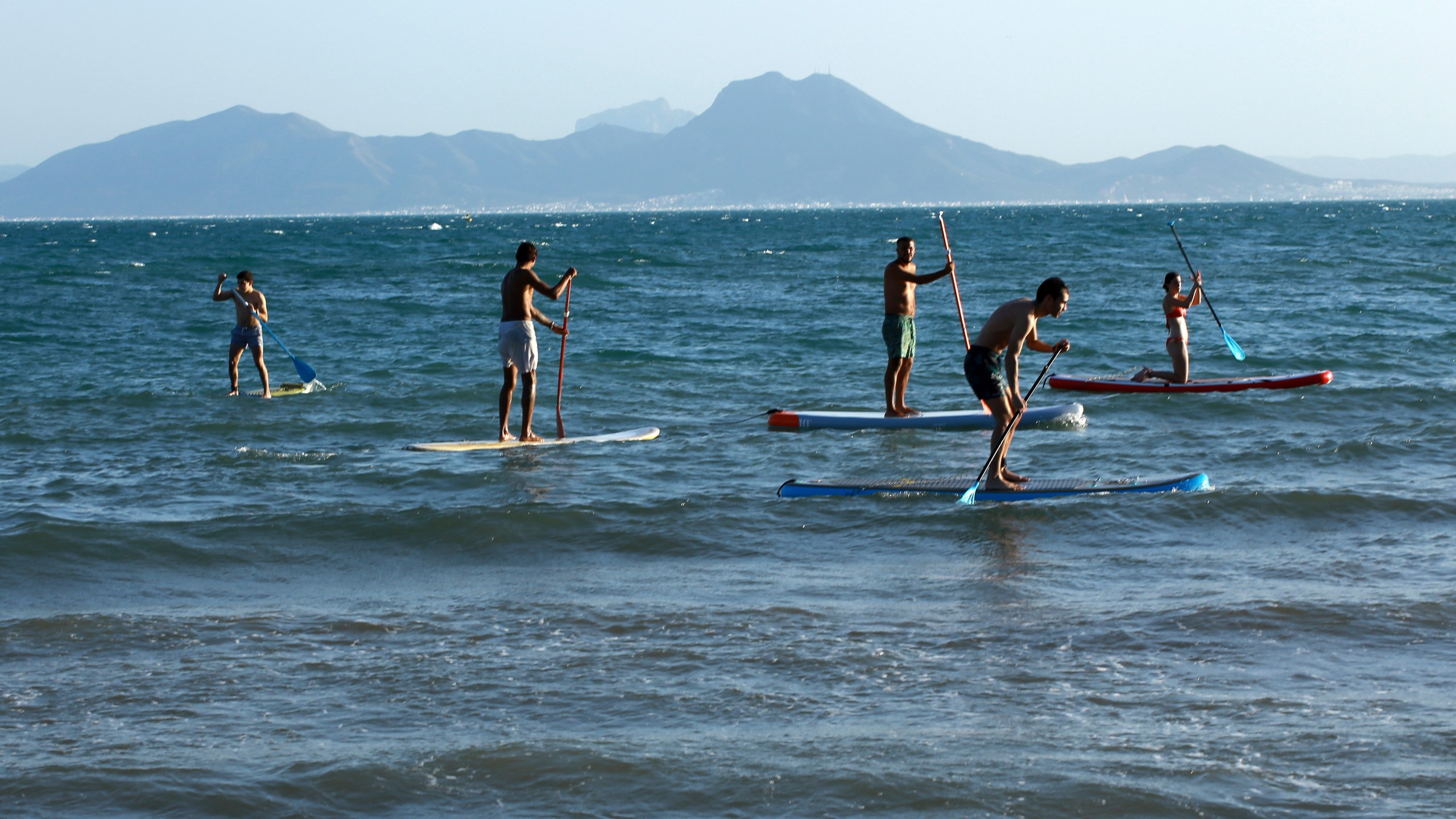 People paddle board in the Mediterranean Sea at Sidi Bousaid beach, in Tunis, Tunisia, Tuesday, Oct. 1, 2024 (AP Photo/Anis Mili)