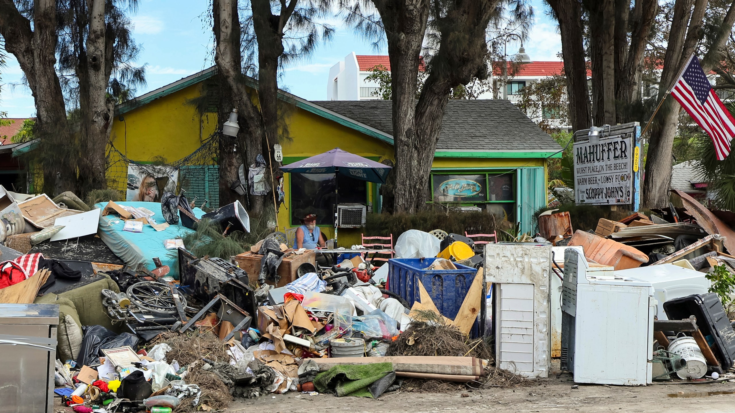 The contents from Mahuffer is on the side of the street after being removed from the flooding of Hurricane Helene on Wednesday, Oct. 2, 2024, in Indian Rocks Beach, Fla. (AP Photo/Mike Carlson)