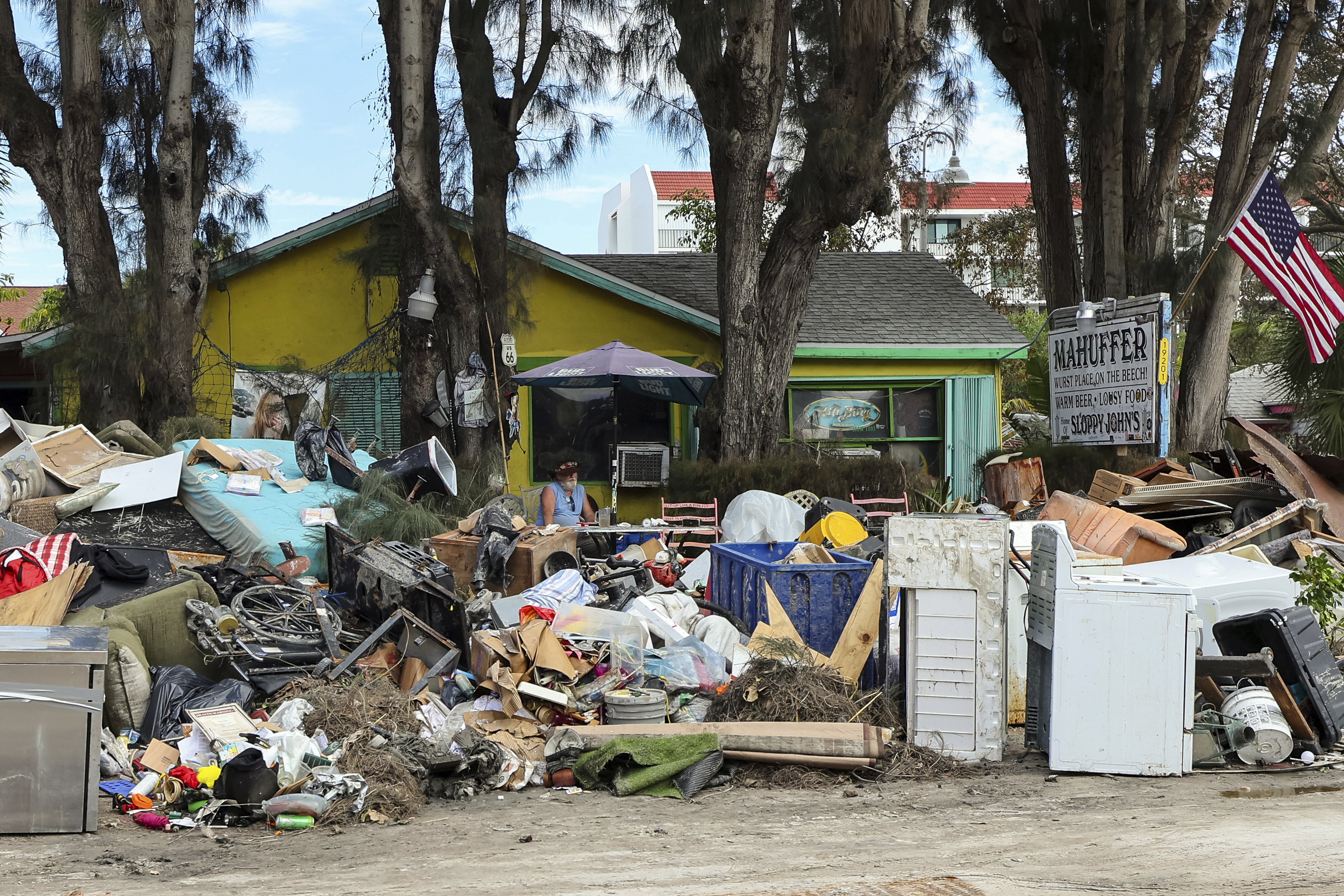 The contents from Mahuffer is on the side of the street after being removed from the flooding of Hurricane Helene on Wednesday, Oct. 2, 2024, in Indian Rocks Beach, Fla. (AP Photo/Mike Carlson)