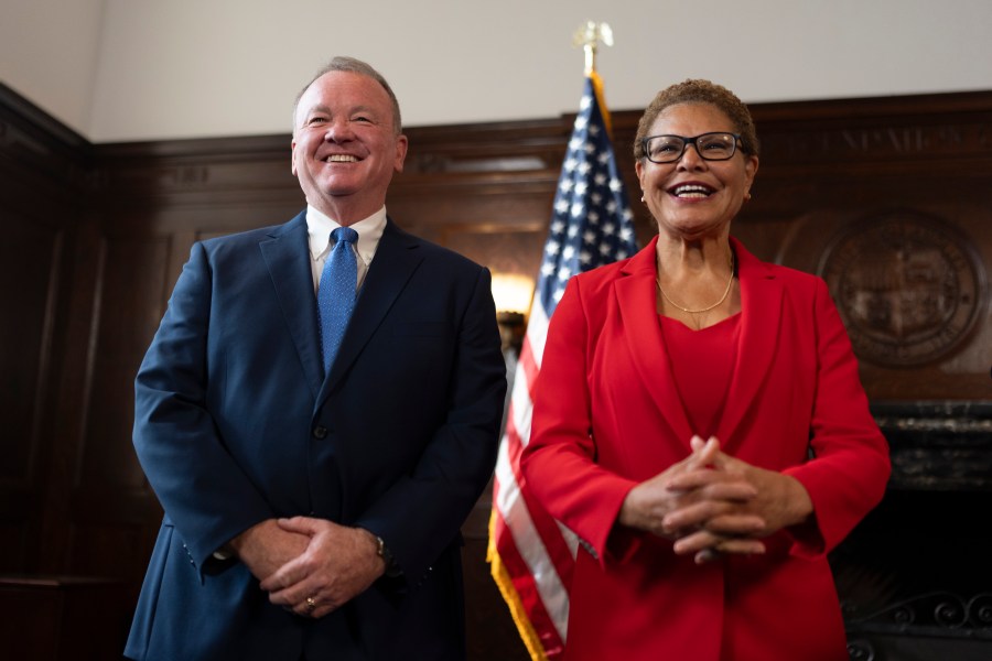 Los Angeles Mayor Karen Bass, right, and newly appointed police chief Jim McDonnell share a light moment during a news conference in Los Angeles, Friday, Oct. 4, 2024. (AP Photo/Jae C. Hong)