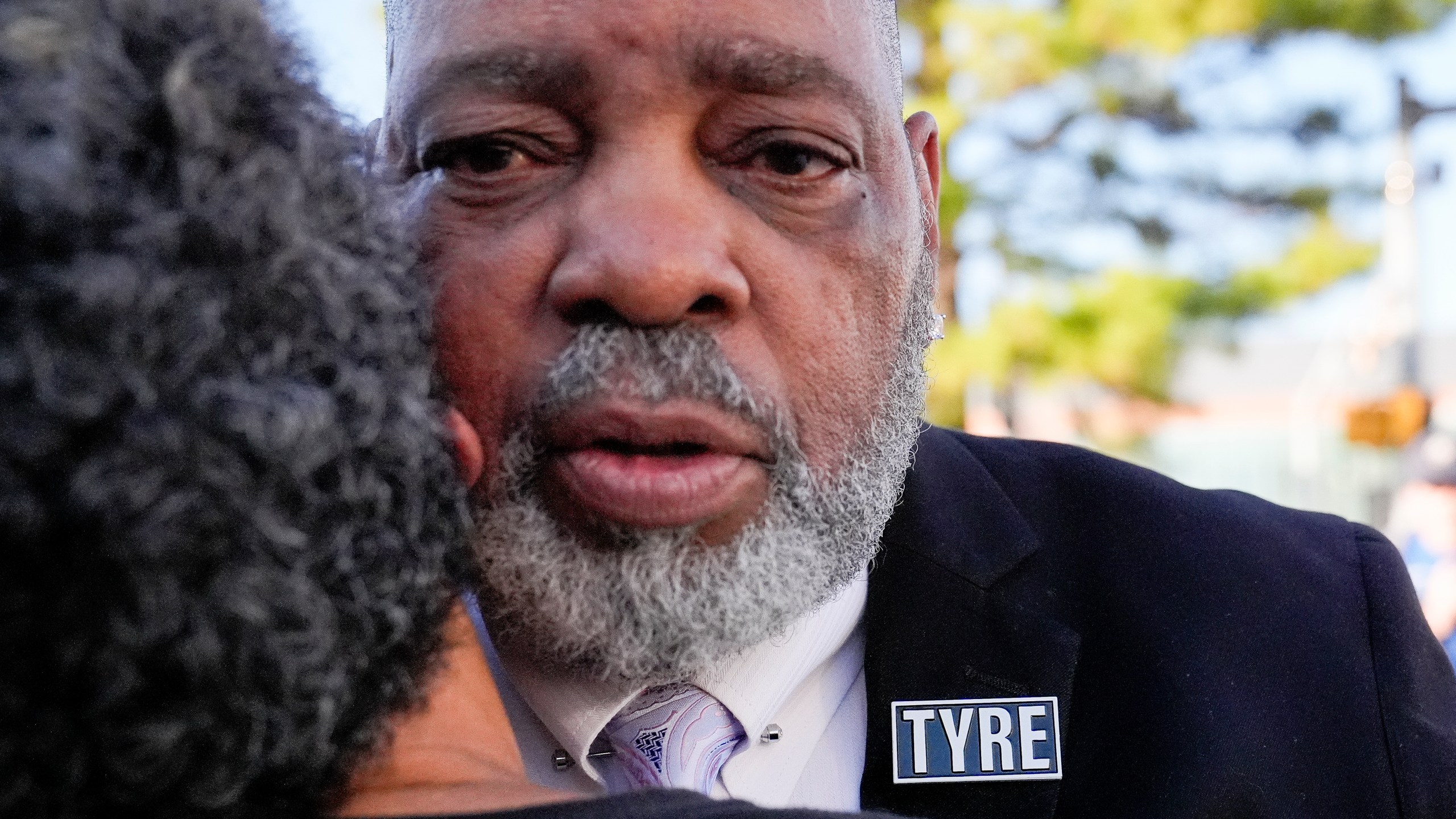 Rodney Wells, stepfather of Tyre Nichols receives a hug from a supporter as he leaves the federal courthouse after three former Memphis police officers were convicted of witness tampering charges in the 2023 fatal beating of his stepson Tyre, Thursday, Oct. 3, 2024, in Memphis, Tenn. (AP Photo/George Walker IV)