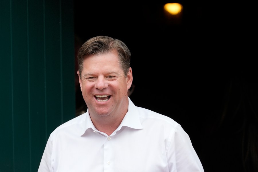 FILE - San Francisco mayoral candidate Mark Farrell smiles while meeting with people at a neighborhood event in San Francisco, Saturday, Sept. 21, 2024. (AP Photo/Jeff Chiu, File)