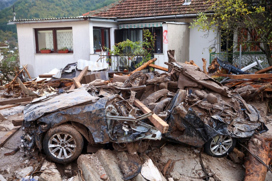 A damaged car is seen after flood hit the village of Donja Jablanica, Bosnia, Saturday, Oct. 5, 2024. (AP Photo/Armin Durgut)