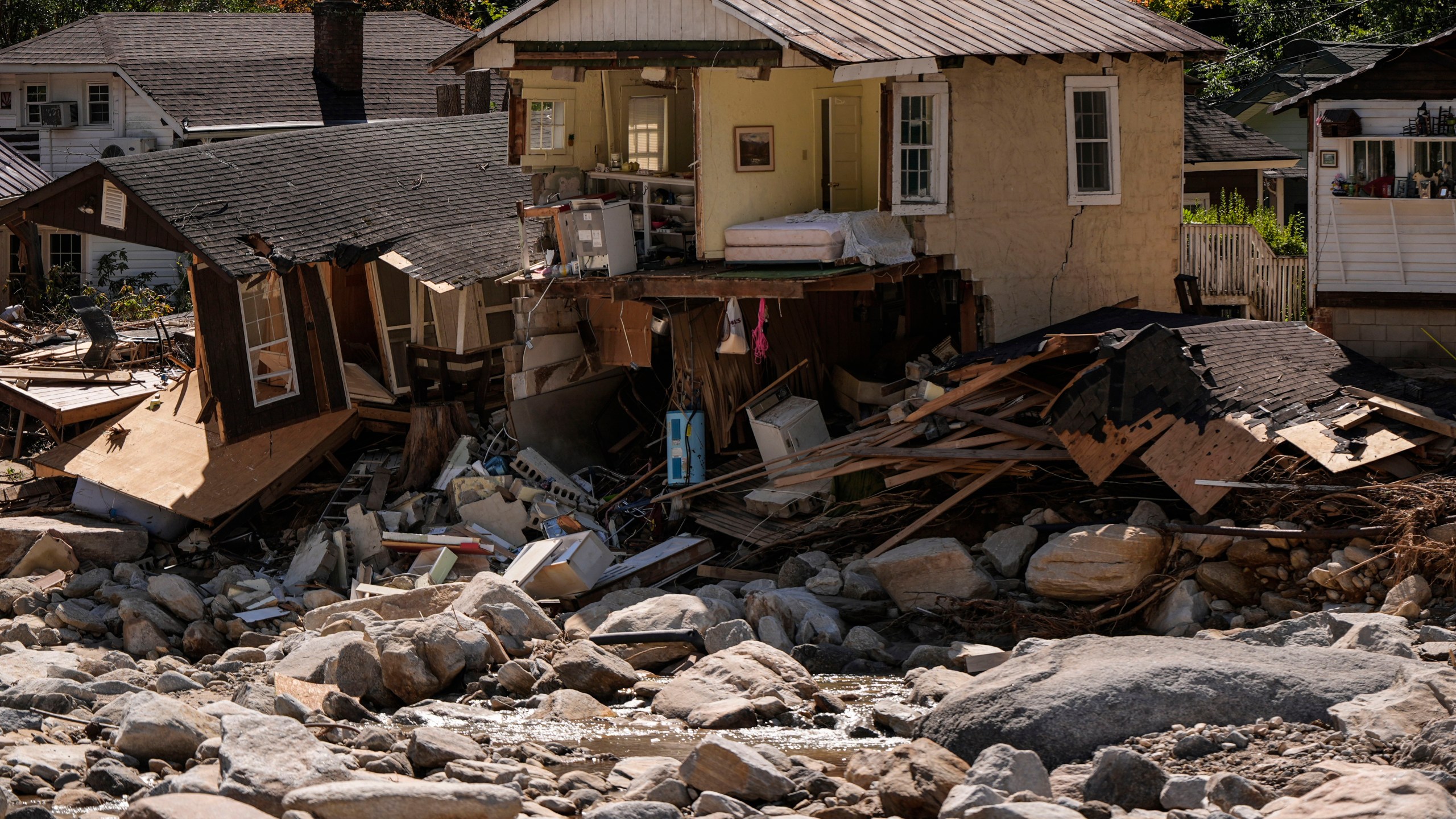 Homes are seen in the aftermath of Hurricane Helene, Wednesday, Oct. 2, 2024, in Chimney Rock Village, N.C. (AP Photo/Mike Stewart)