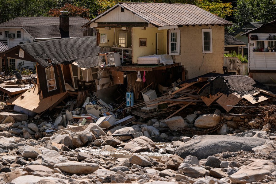 Homes are seen in the aftermath of Hurricane Helene, Wednesday, Oct. 2, 2024, in Chimney Rock Village, N.C. (AP Photo/Mike Stewart)