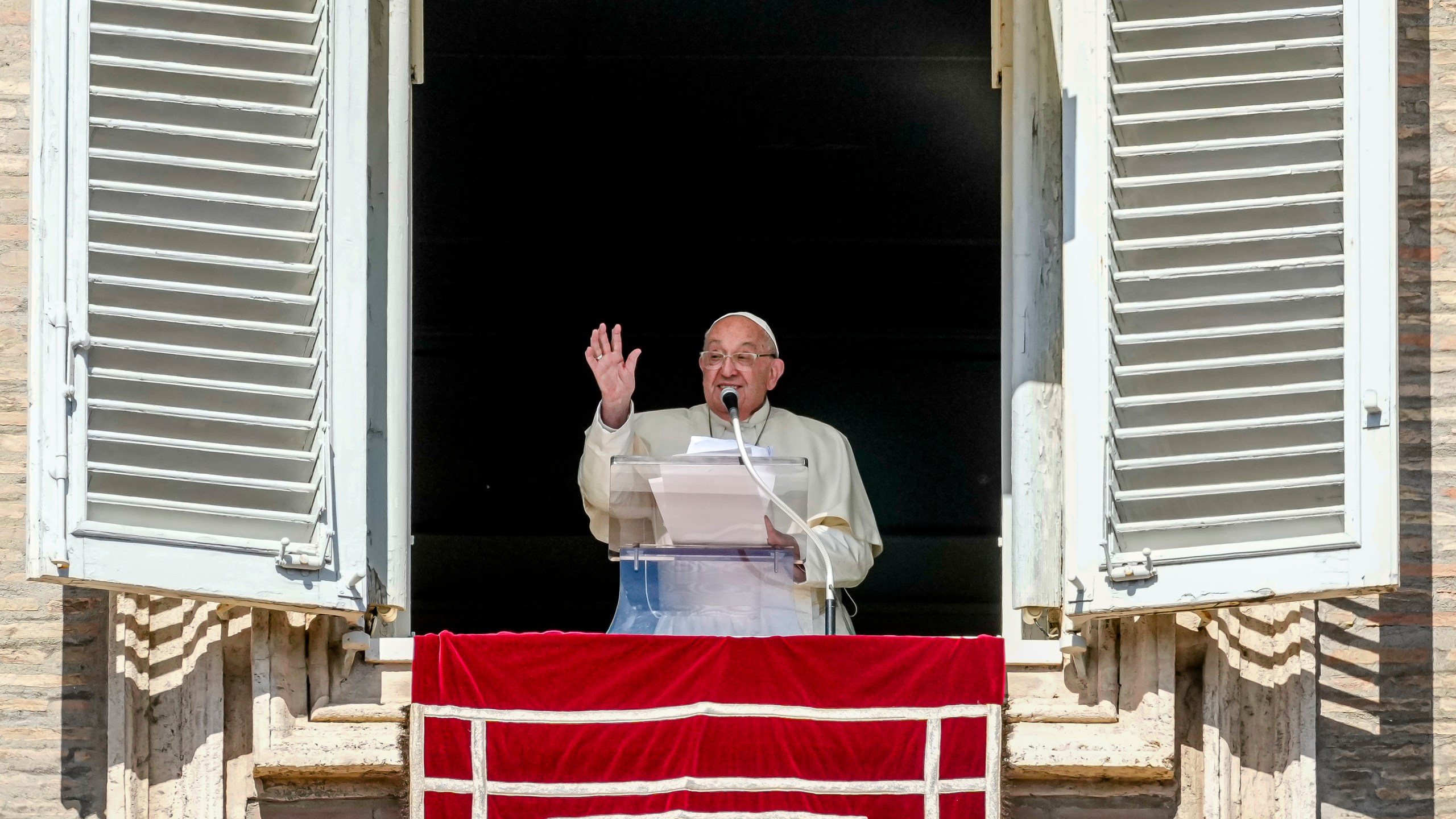 Pope Francis appears at his studio window for the traditional noon blessing of faithful and pilgrims gathered in St. Peter's Square at The Vatican, Sunday, Oct. 6, 2024. (AP Photo/Andrew Medichini)