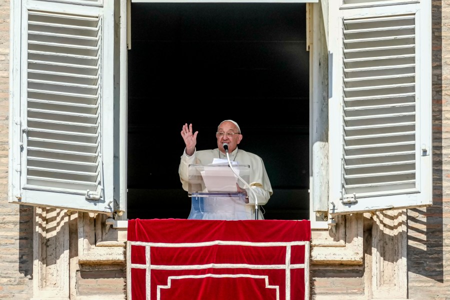 Pope Francis appears at his studio window for the traditional noon blessing of faithful and pilgrims gathered in St. Peter's Square at The Vatican, Sunday, Oct. 6, 2024. (AP Photo/Andrew Medichini)