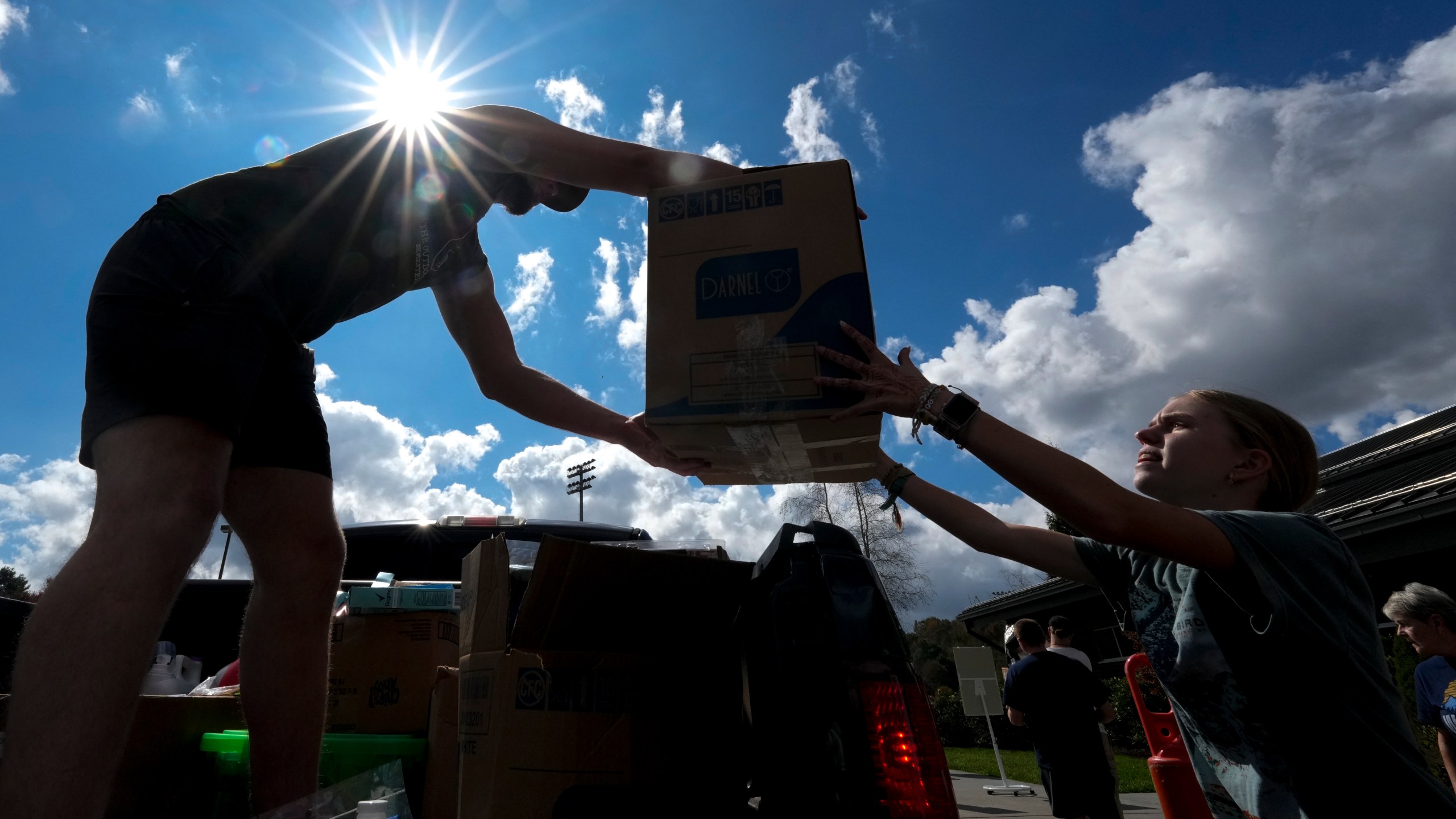 Will Spears unloads supplies at Watauga High School on Thursday, Oct. 3, 2024, in Boone, N.C. in the aftermath of hurricane Helene. In the final weeks of the presidential election, people in North Carolina and Georgia, influential swing states, are dealing with more immediate concerns: recovering from Hurricane Helene. (AP Photo/Chris Carlson)