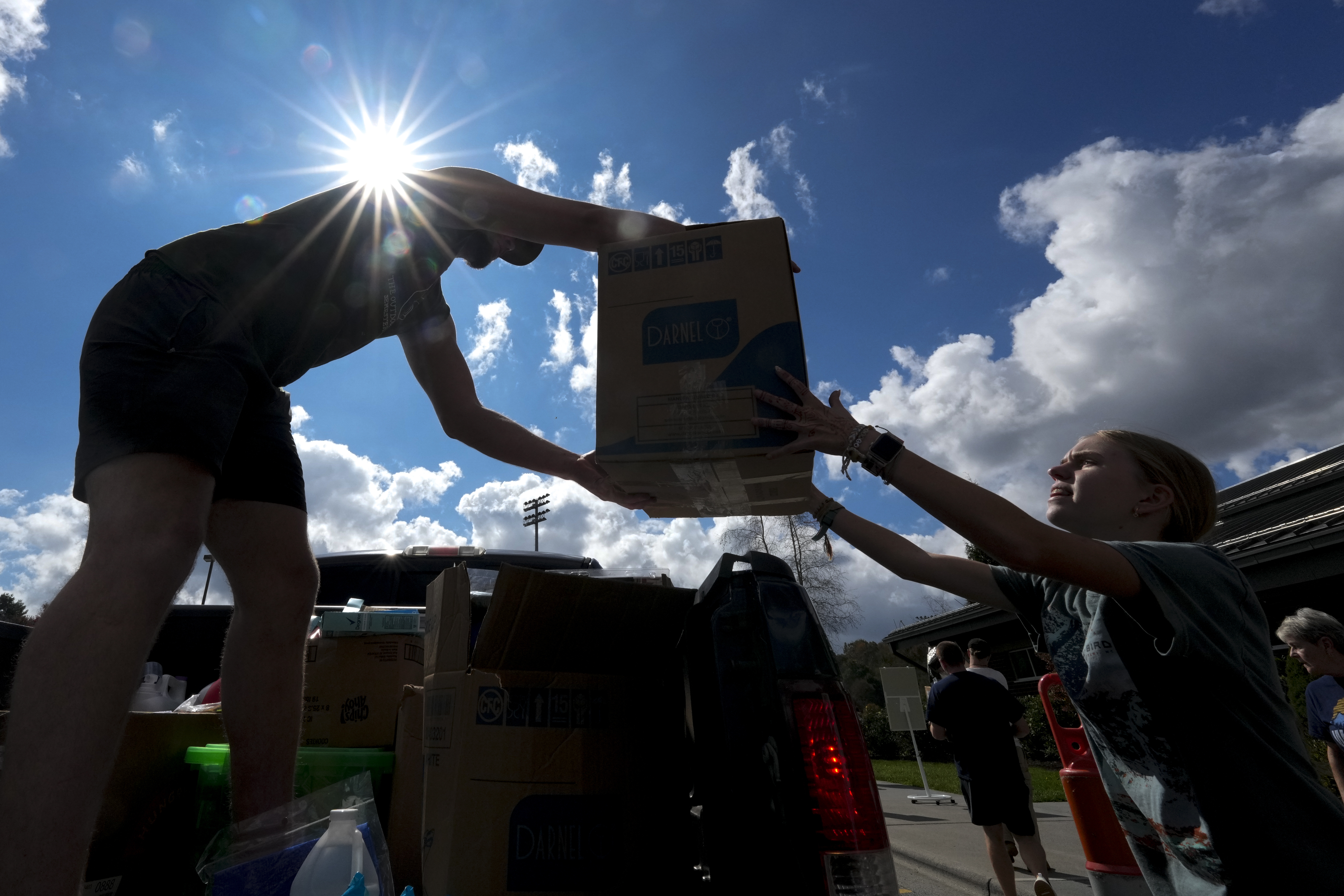 Will Spears unloads supplies at Watauga High School on Thursday, Oct. 3, 2024, in Boone, N.C. in the aftermath of hurricane Helene. In the final weeks of the presidential election, people in North Carolina and Georgia, influential swing states, are dealing with more immediate concerns: recovering from Hurricane Helene. (AP Photo/Chris Carlson)