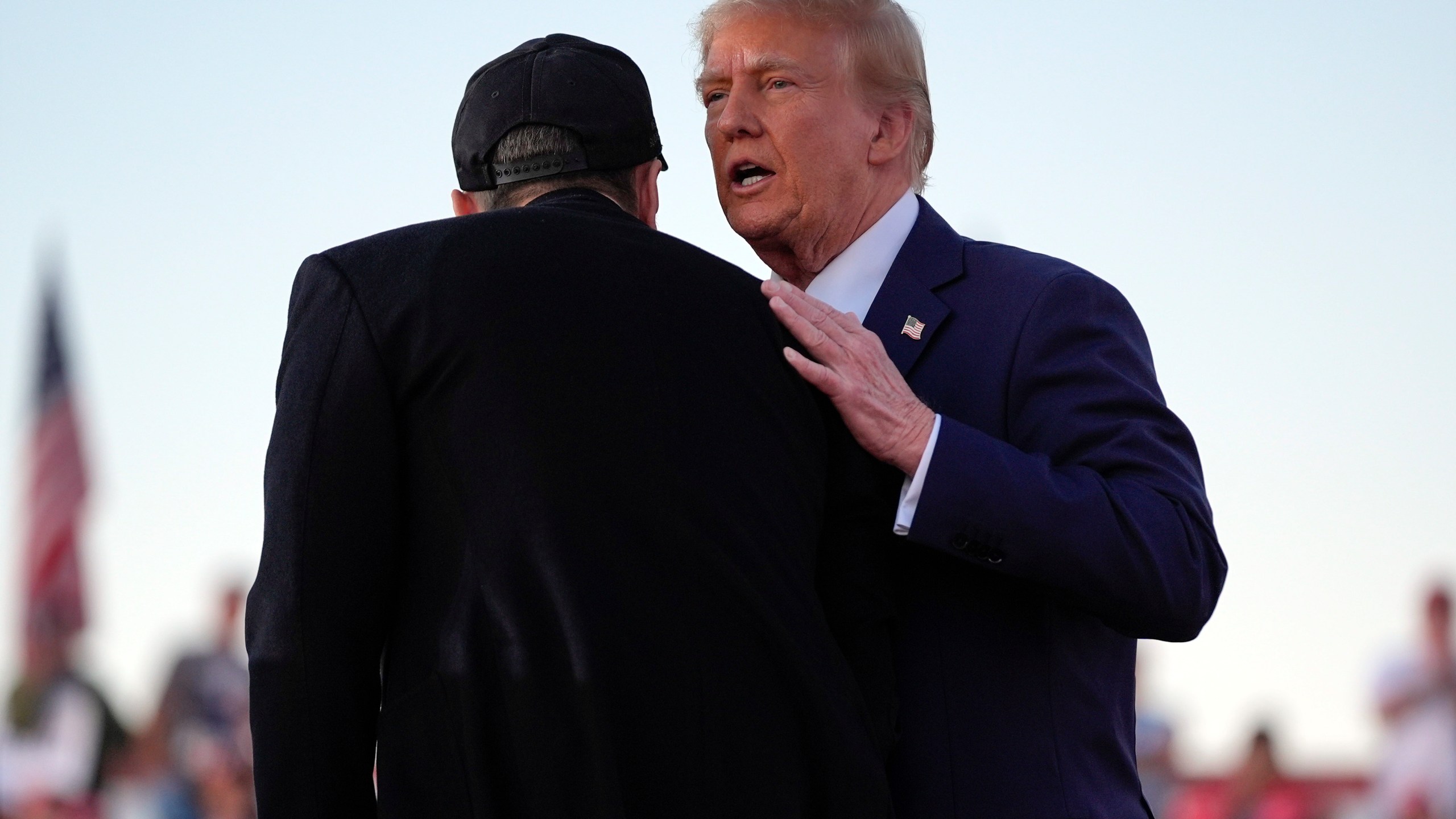 Republican presidential nominee former President Donald Trump shakes hands with Elon Musk at a campaign rally at the Butler Farm Show, Saturday, Oct. 5, 2024, in Butler, Pa. (AP Photo/Evan Vucci)