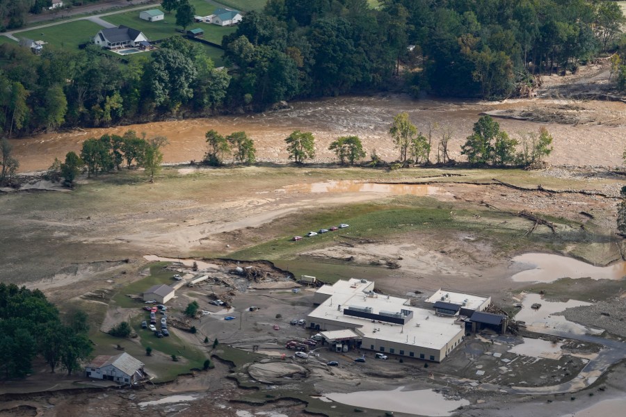 An aerial view of flood-damaged Unicoi County Hospital in the aftermath of Hurricane Helene, Saturday, Sept. 28, 2024, in Erwin, Tenn. (AP Photo/George Walker IV)