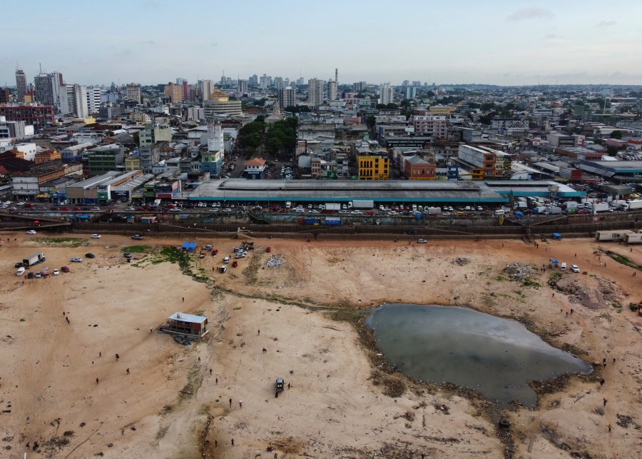 A part of the Negro River is dry at the port in Manaus, Amazonas state, Brazil, Friday, Oct. 4, 2024, amid severe drought. (AP Photo/Edmar Barros)