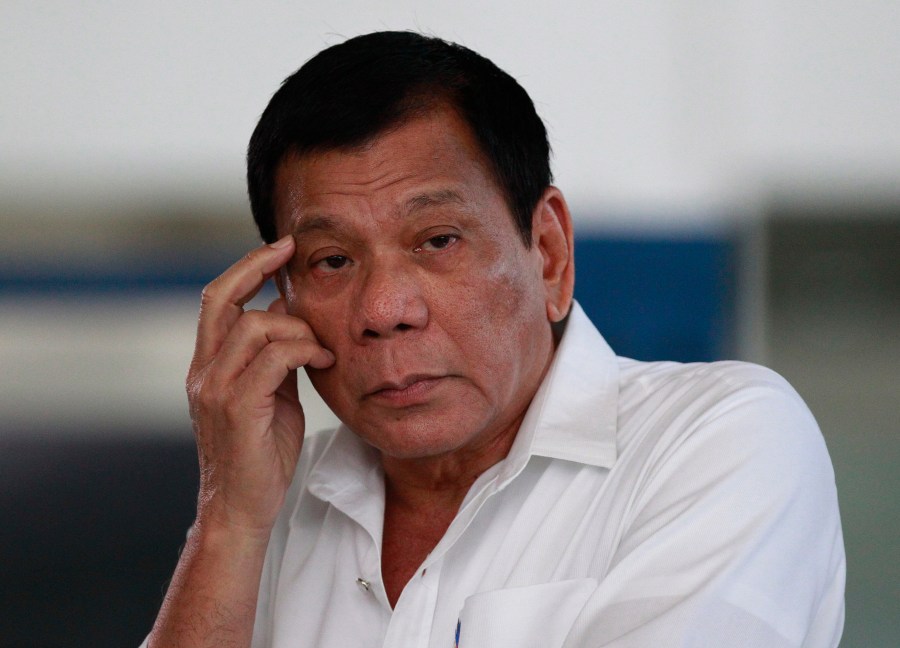 FILE -Philippine President Rodrigo Duterte listens to a question from reporters at Manila's International Airport, Philippines on, Nov. 9, 2016. (AP Photo/Aaron Favila, File)