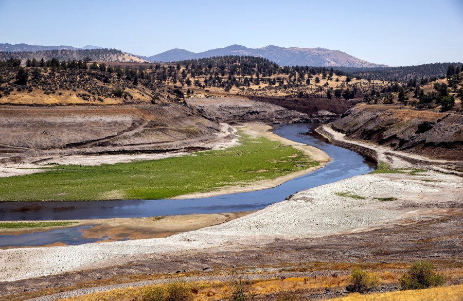 FILE - The Klamath River flows where Iron Gate Reservoir once was as work to remove of the Iron Gate and Copco Dams continues on the Klamath River near Hornbook, Calif., July 25, 2024. (Carlos Avila Gonzalez/San Francisco Chronicle via AP, File)