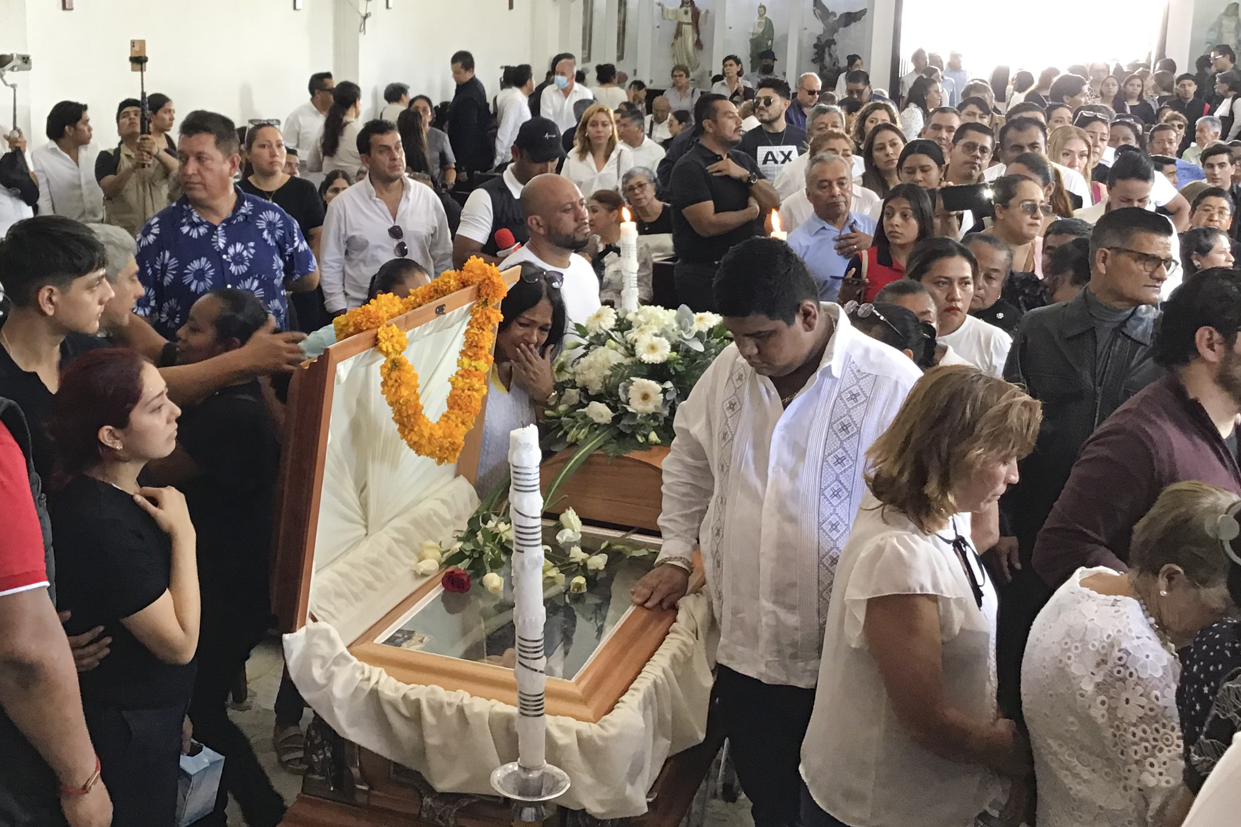 Supporters of slain Mayor Alejandro Arcos attend his funeral Mass one week after he took office, in Chilpancingo, Mexico, Monday, Oct. 7, 2024. (AP Photo/Alejandrino Gonzalez)