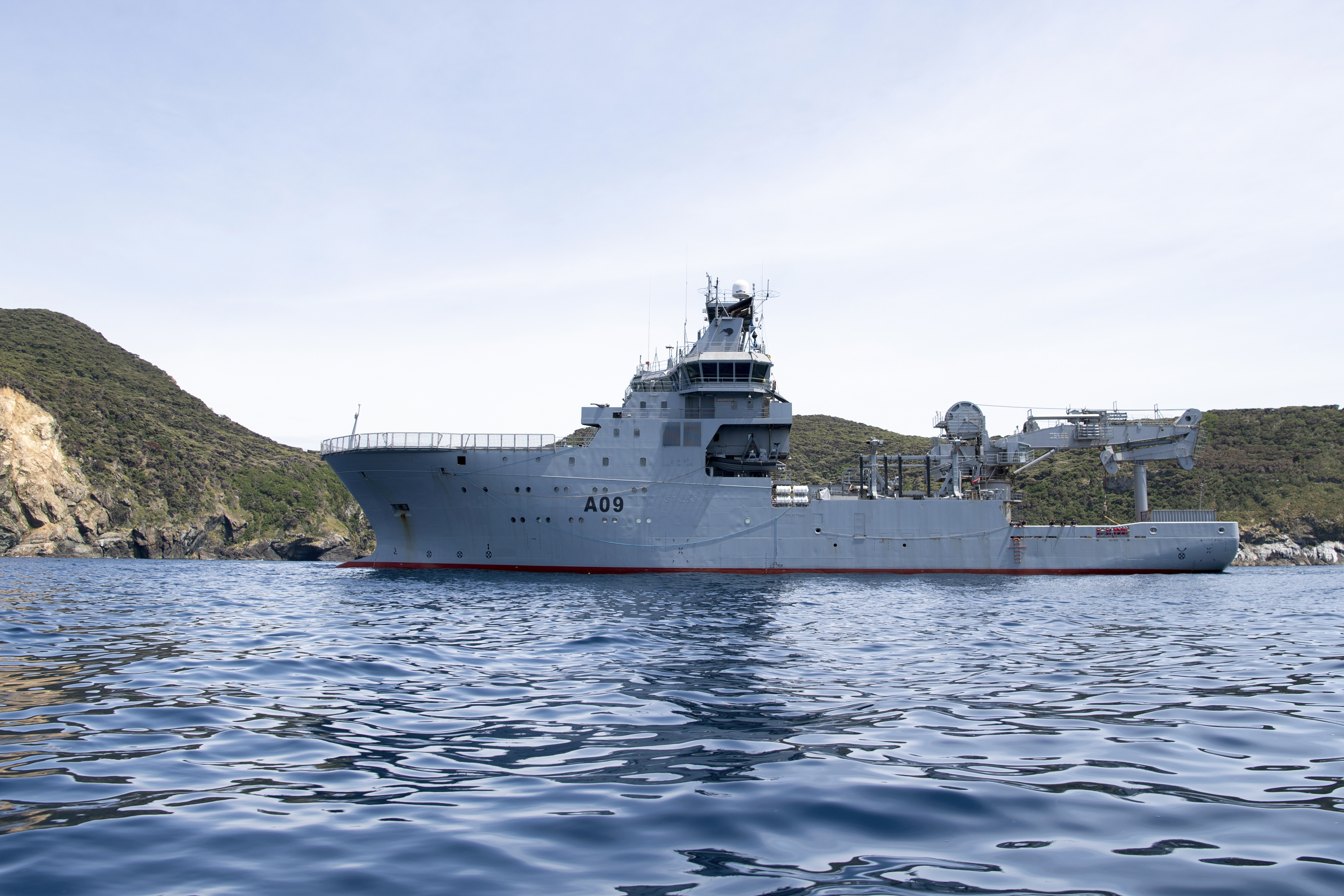 This image released by New Zealand Defence Force (NZDF), shows HMNZS Manawanui at the Three Kings islands off the coast New Zealand, on Dec. 1, 2023. (Petty Officer Chris Weissenborn/NZDF via AP)