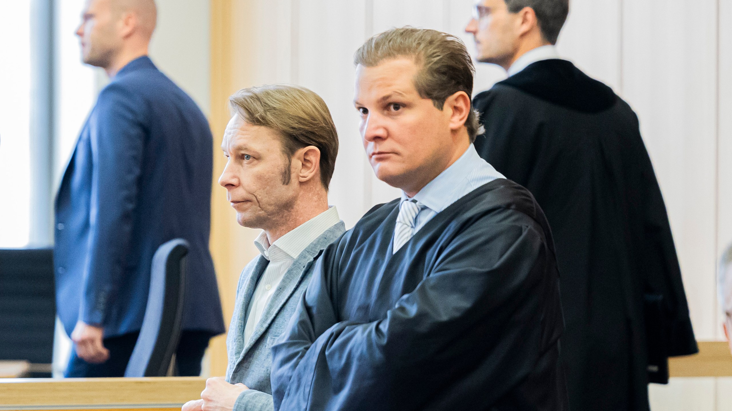 Christian Brueckner, center, stands in the courtroom at Braunschweig District Court before the start of the trial, in Brunswick, Germany, Tuesday Oct. 8, 2024. (Michael Matthey/dpa via AP)