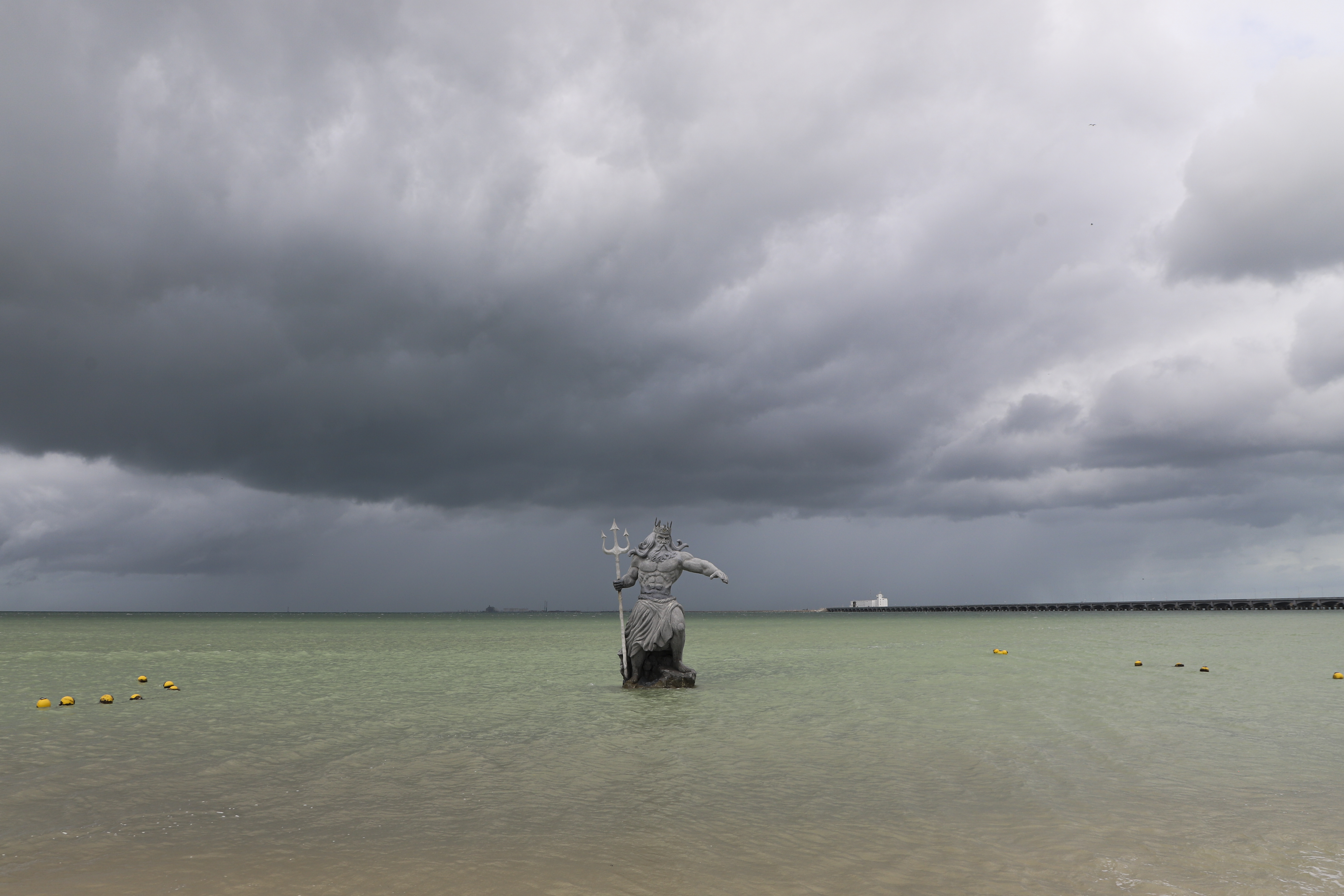 A sculpture of Poseidon stands in the ocean before the arrival of Hurricane Milton in Progreso, Yucatan state, Mexico, Monday, Oct. 7, 2024. (AP Photo/Martin Zetina)