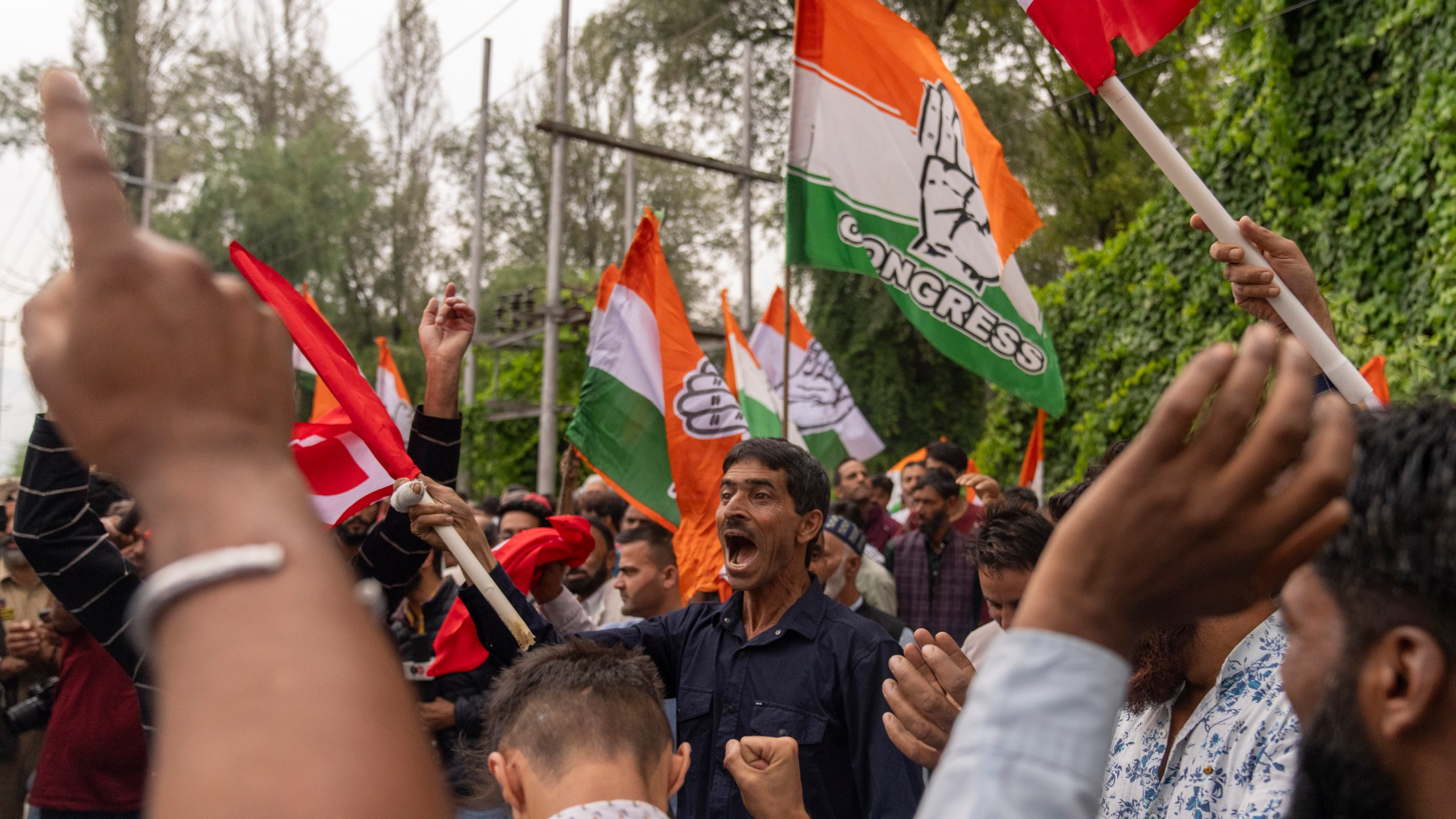 Supporters of National Conference party shout slogans as they celebrate early leads in the election for a local government in Indian controlled Kashmir, Srinagar, Tuesday, Oct. 8, 2024. (AP Photo/Dar Yasin)