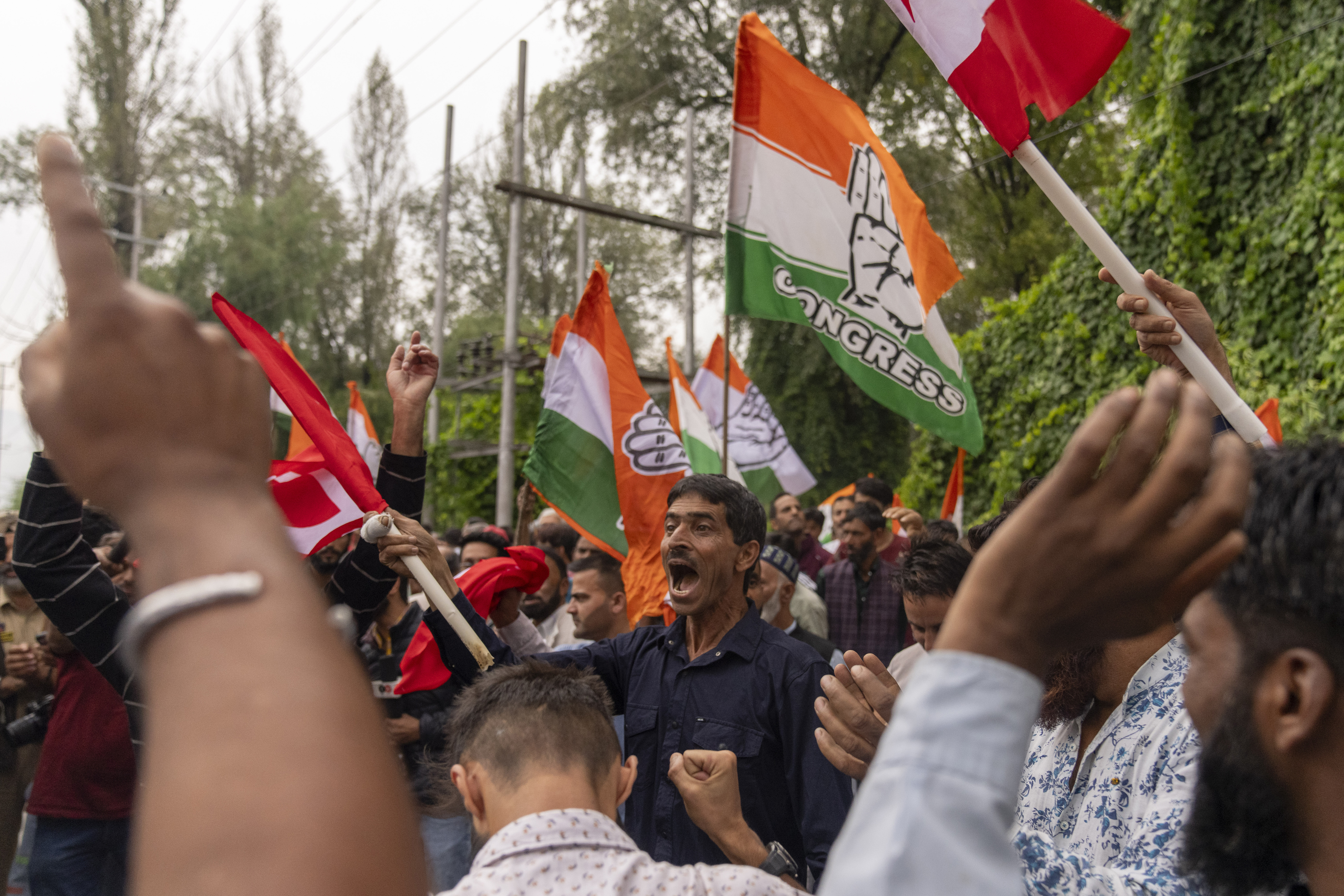 Supporters of National Conference party shout slogans as they celebrate early leads in the election for a local government in Indian controlled Kashmir, Srinagar, Tuesday, Oct. 8, 2024. (AP Photo/Dar Yasin)