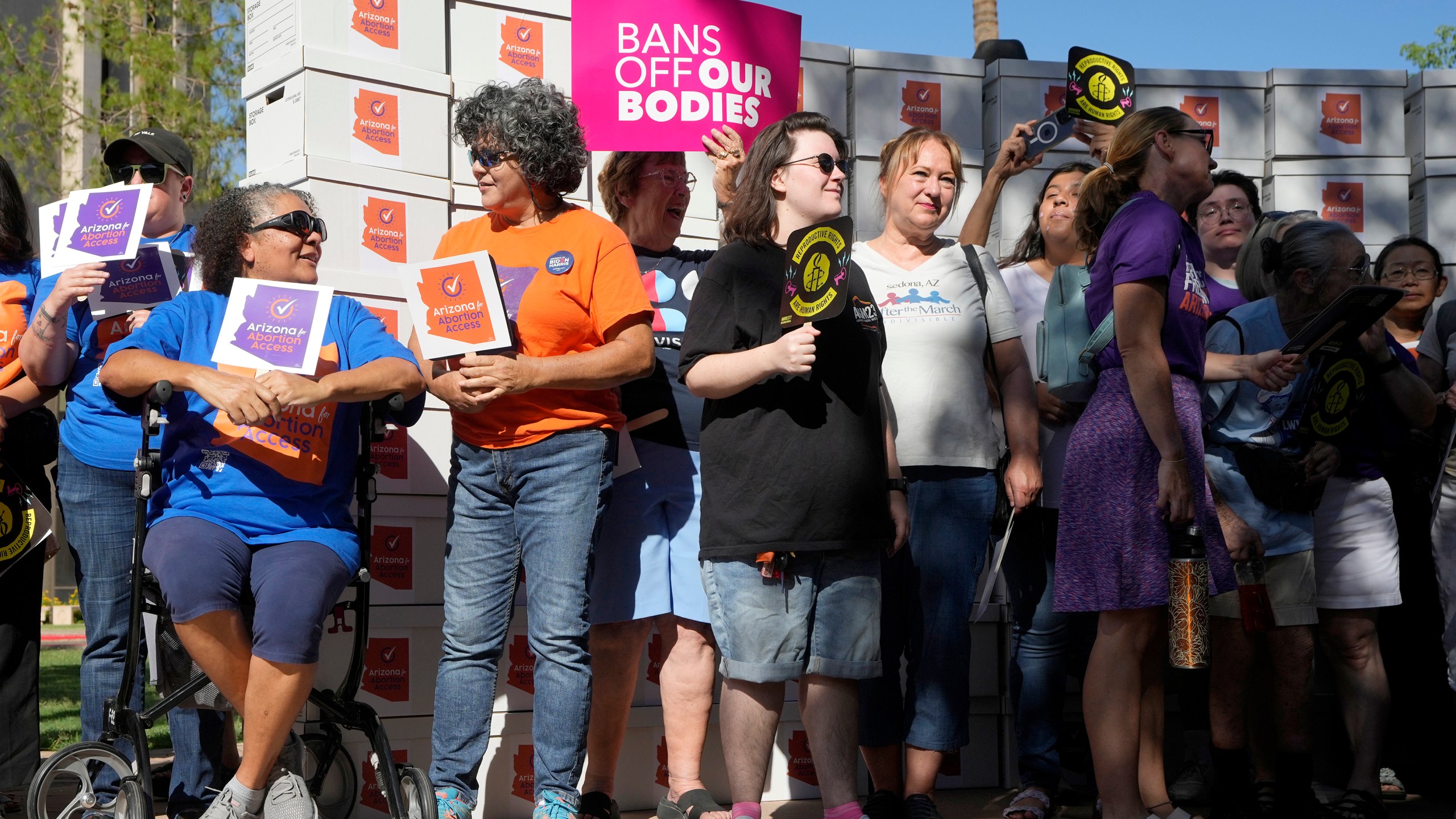 FILE - Arizona abortion-rights supporters gather for a news conference prior to delivering over 800,000 petition signatures to the capitol to get abortion rights on the November general election ballot Wednesday, July 3, 2024, in Phoenix. (AP Photo/Ross D. Franklin, File)