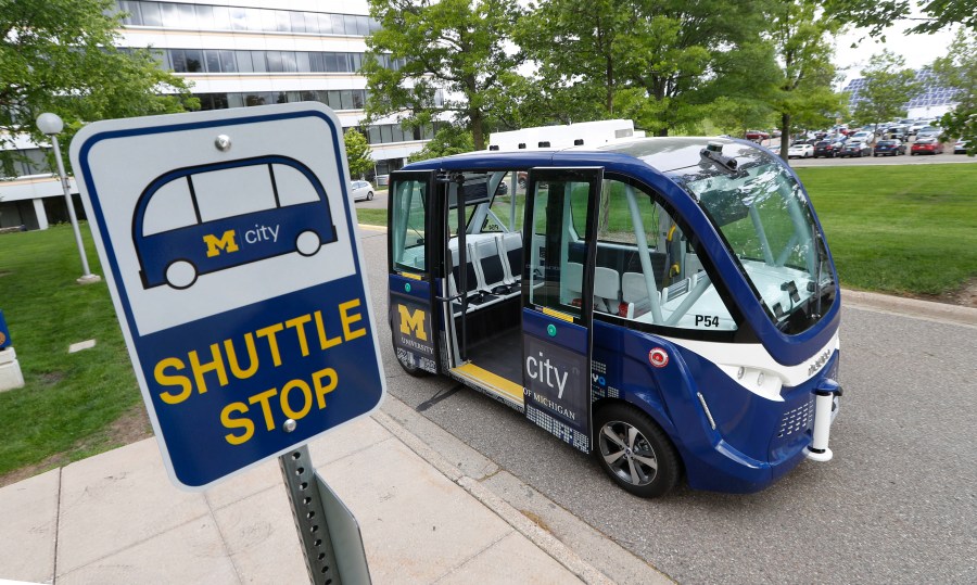 FILE - A Mcity driverless shuttle makes a stop on June 4, 2018 at the University of Michigan in Ann Arbor, Mich. (AP Photo/Paul Sancya)