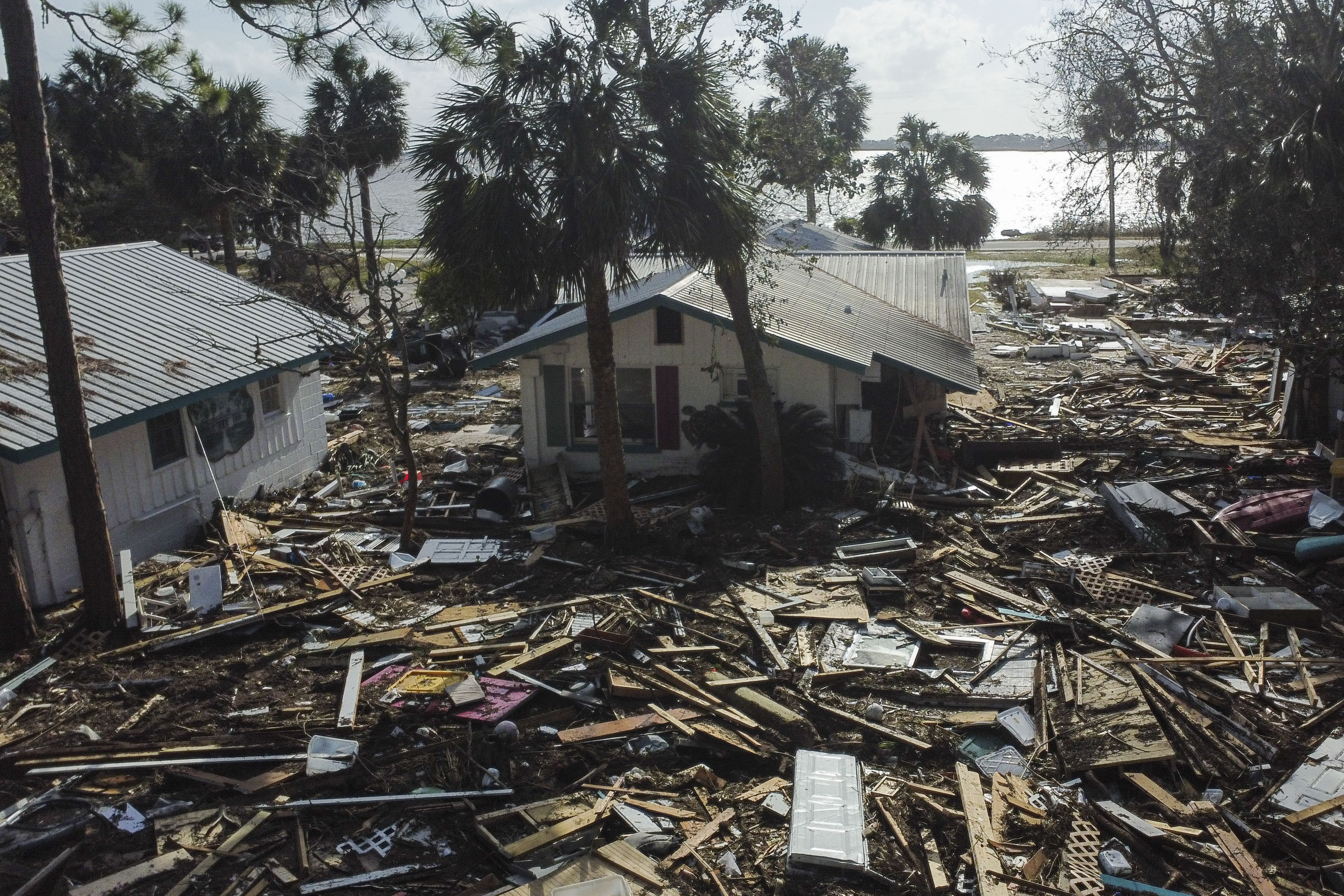 FILE - Debris surrounds the Faraway Inn Cottages and Motel in the aftermath of Hurricane Helene, in Cedar Key, Fla., Sept. 27, 2024. (AP Photo/Stephen Smith, File)