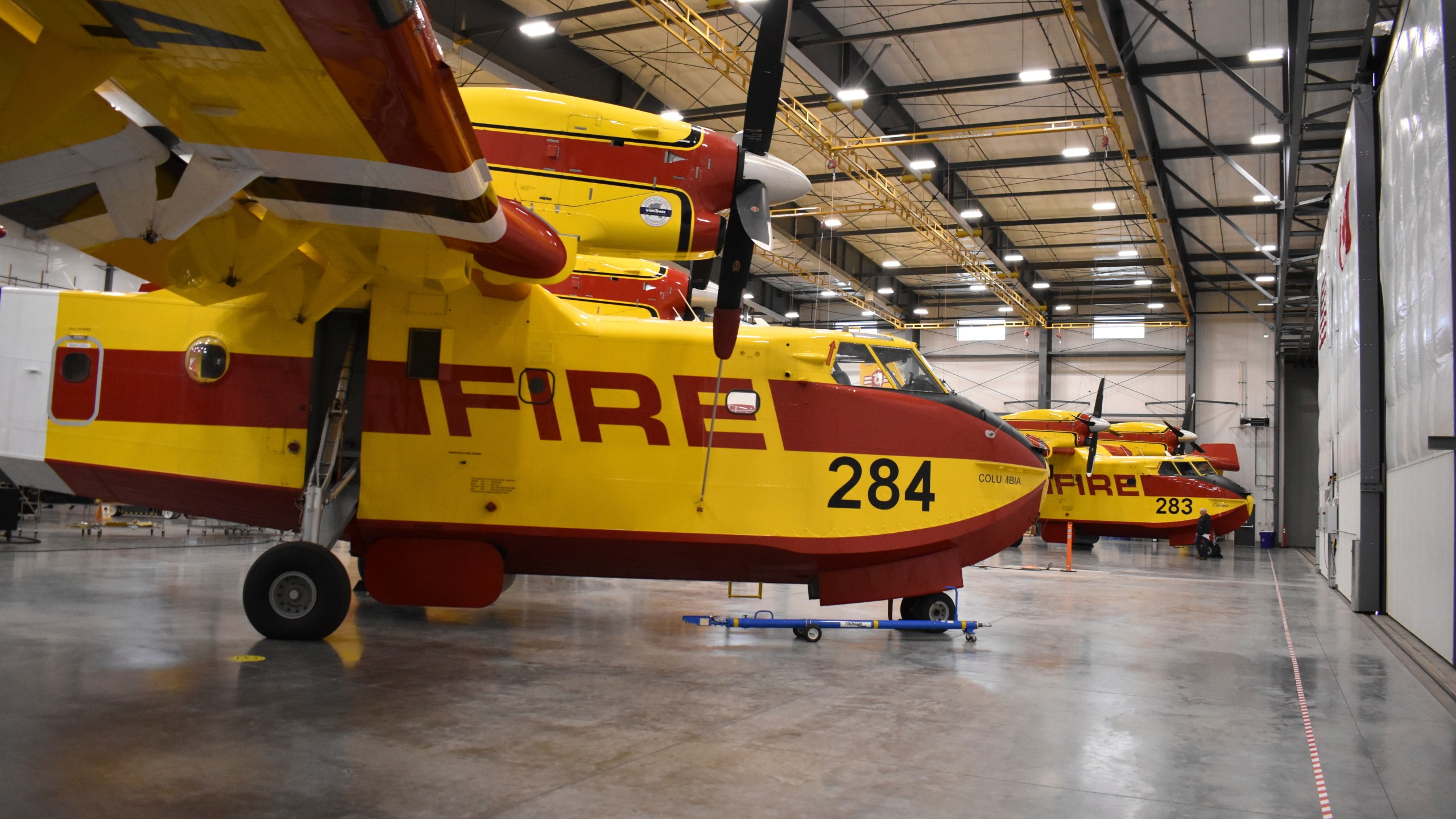 Firefighting aircraft known as "Super Scoopers" are seen inside a Bridger Aerospace hangar at Bozeman Yellowstone International Airport, Oct. 27, 2022, in Belgrade, Mont. (AP Photo/Matthew Brown)