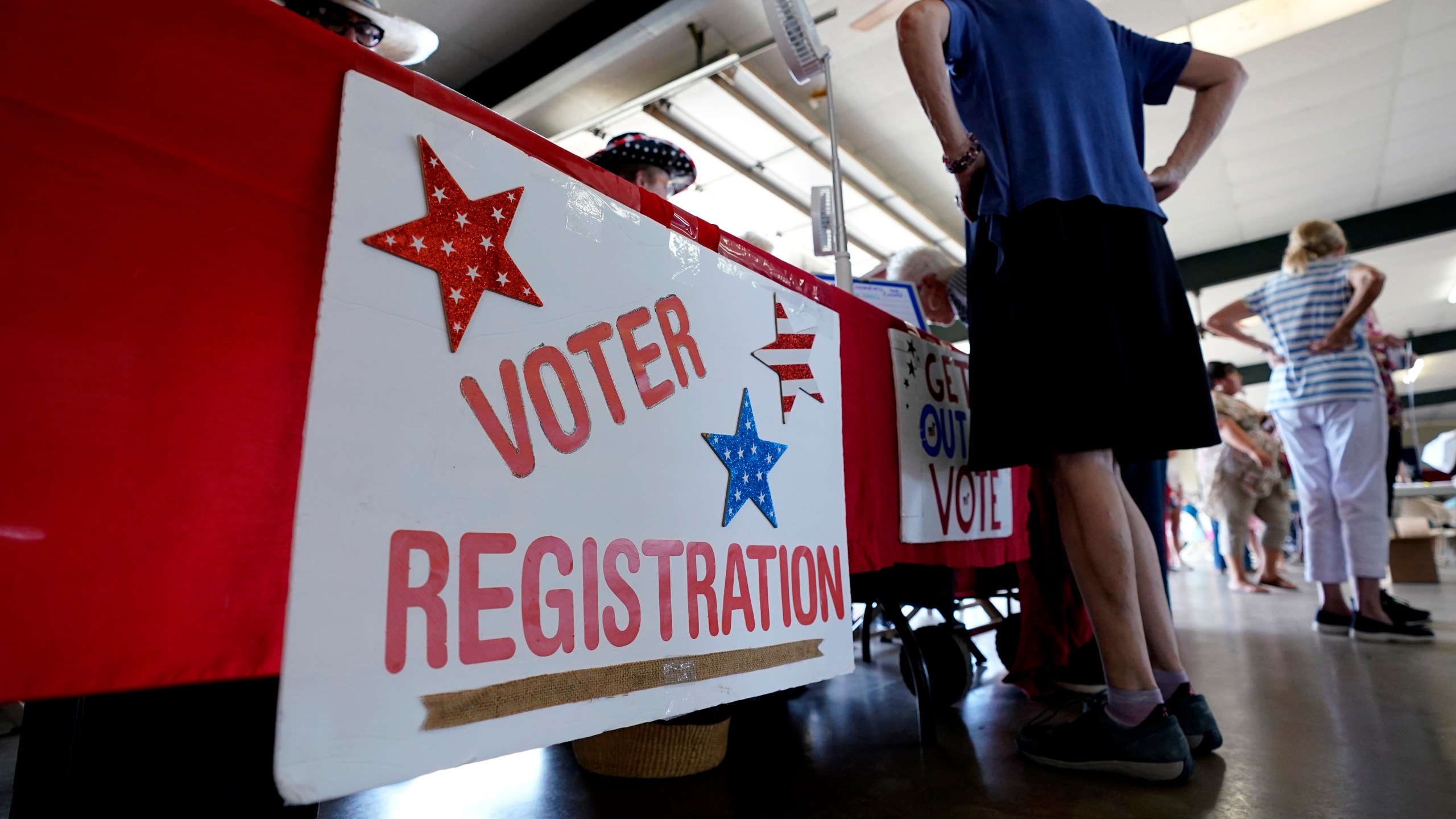 FILE - A voter registration table is seen at a political event for Texas gubernatorial candidate Beto O'Rourke, Wednesday, Aug. 17, 2022, in Fredericksburg, Texas. (AP Photo/Eric Gay, File)