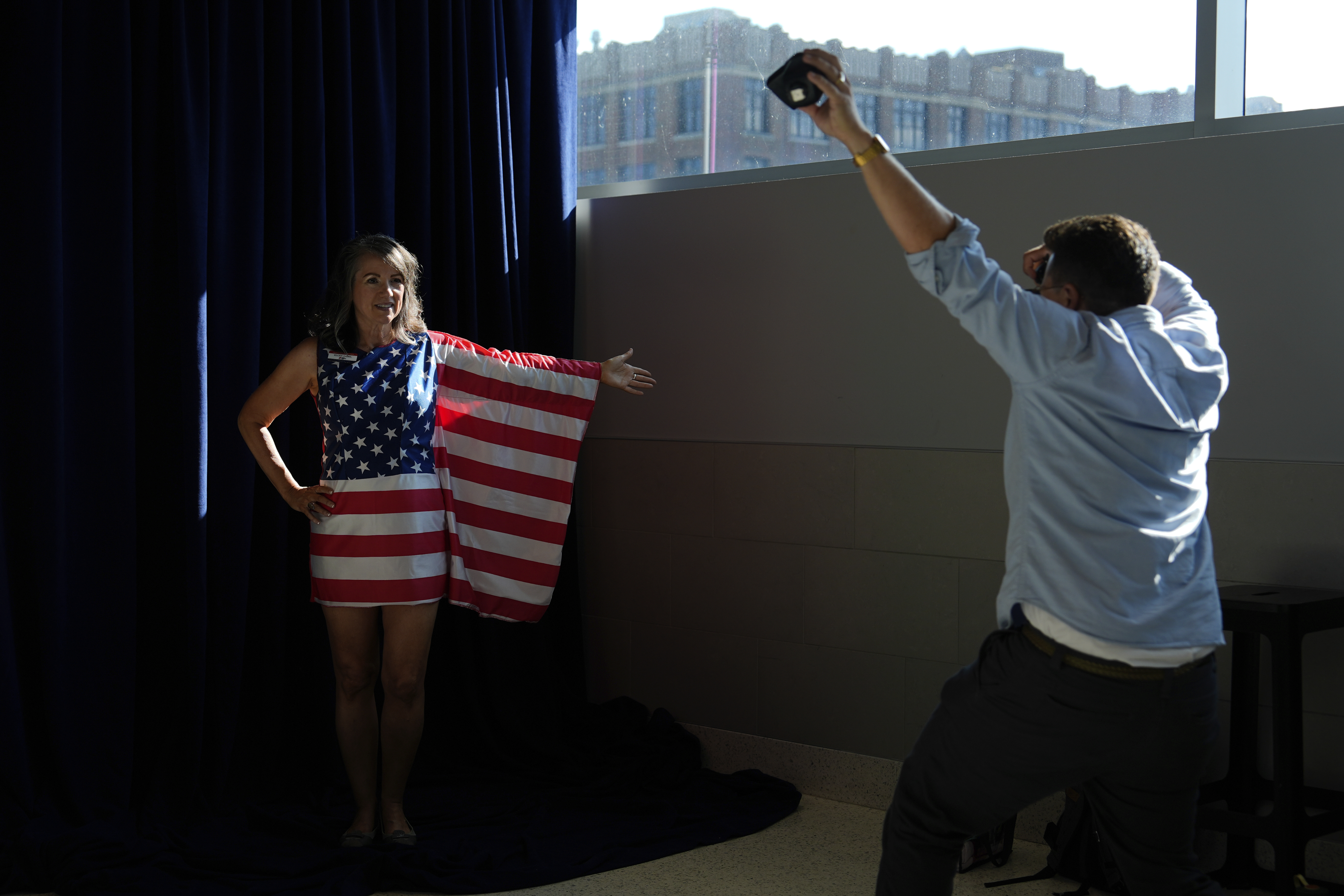 FILE - A person in American flag poses for pictures during the Republican National Convention Thursday, July 18, 2024, in Milwaukee. (AP Photo/Julia Nikhinson, File)