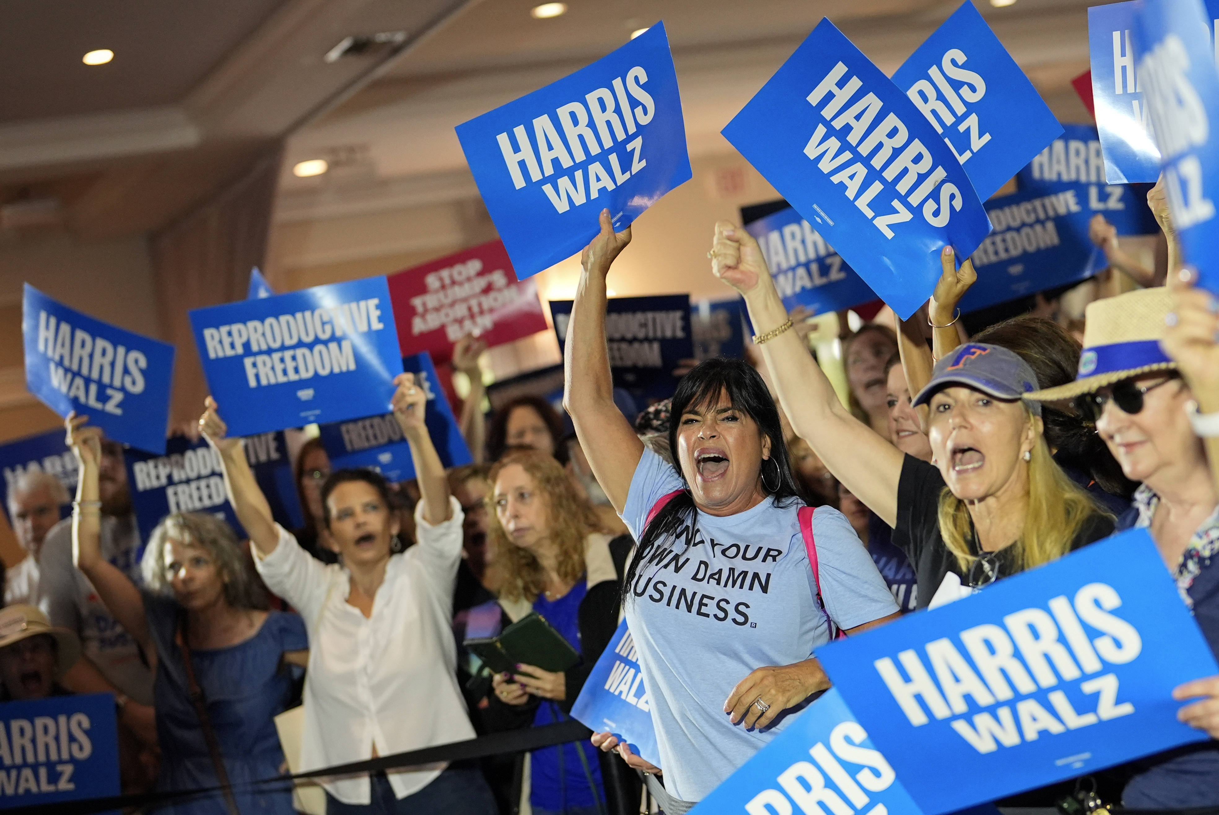 FILE - Supporters cheer as speakers arrive at an event kicking off a national "Reproductive Freedom Bus Tour" by the campaign of Democratic presidential nominee Vice President Kamala Harris and running mate Gov. Tim Walz, Sept. 3, 2024, in Boynton Beach, Fla. (AP Photo/Rebecca Blackwell, File)